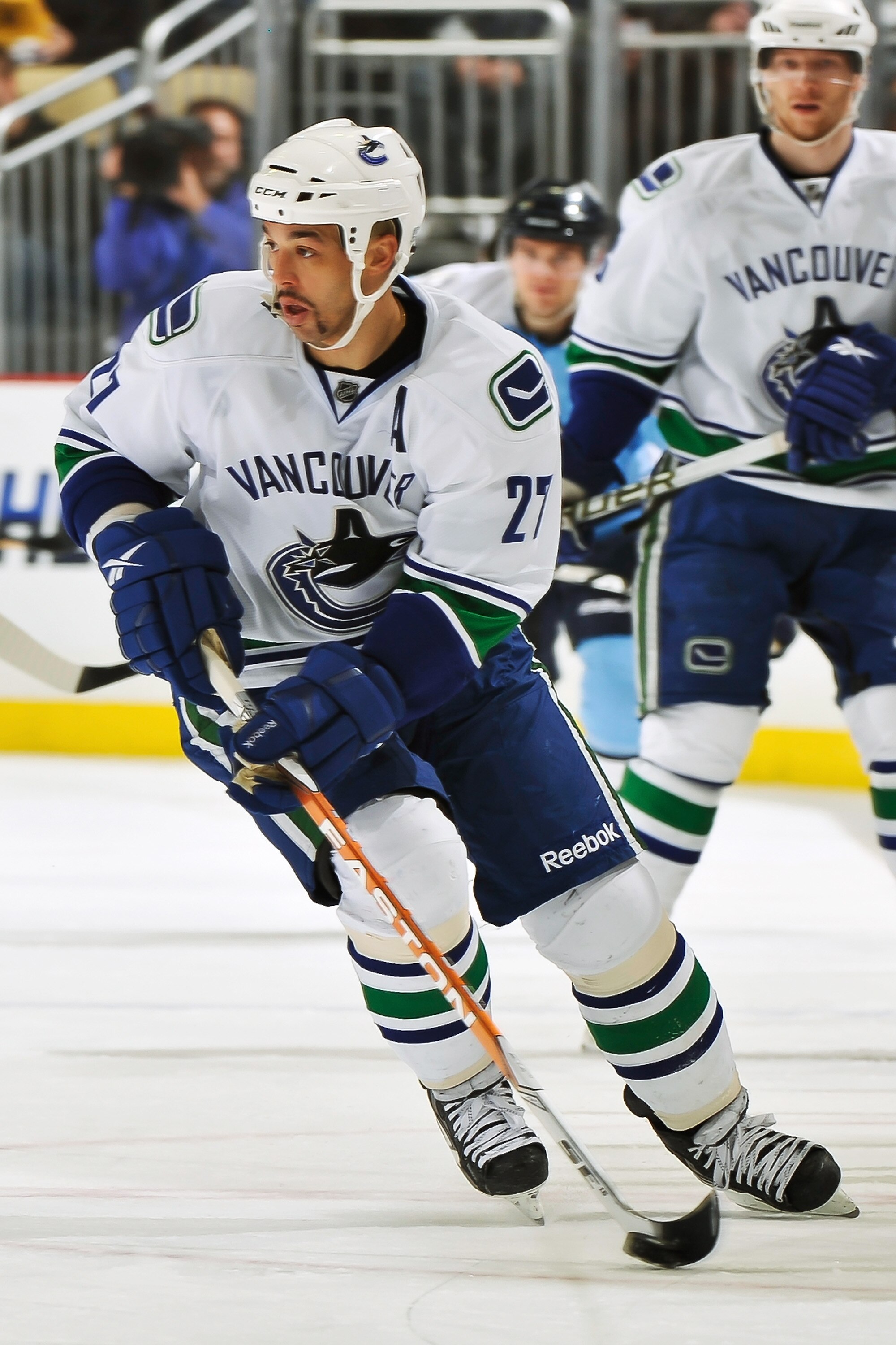 PITTSBURGH - NOVEMBER 17:  Manny Malhotra #27 of the Vancouver Canucks skates with the puck against the Pittsburgh Penguins on November 17, 2010 at Consol Energy Center in Pittsburgh, Pennsylvania.  (Photo by Jamie Sabau/Getty Images)