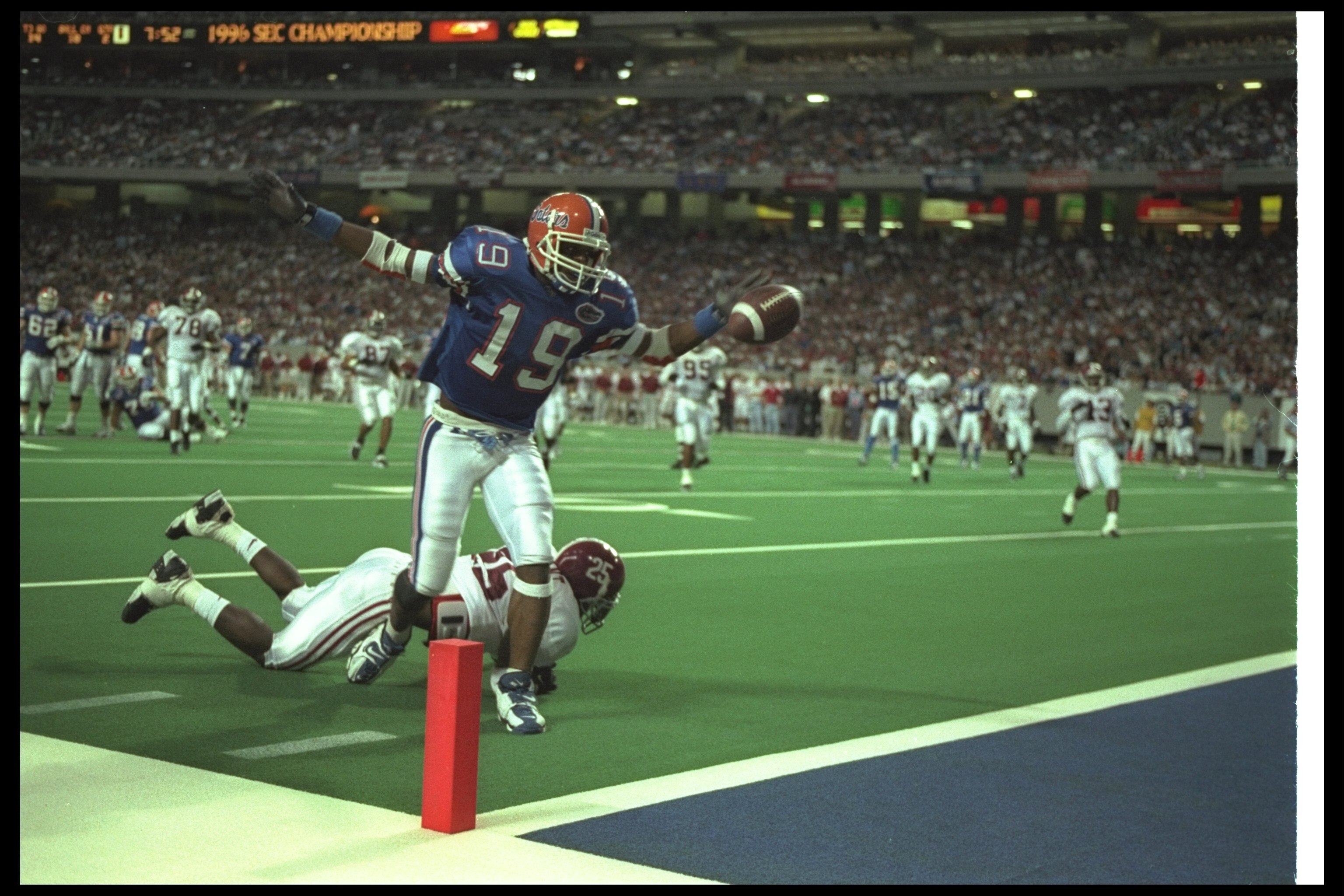 7 Dec 1996:  Wide receiver Ike Hilliard of the Florida Gators celebrates as he scores a touchdown during the SEC Championship game against the Alabama Crimson Tide at the Georgia Dome in Atlanta, Georgia.  Florida won the game, 45-30. Mandatory Credit: Ma