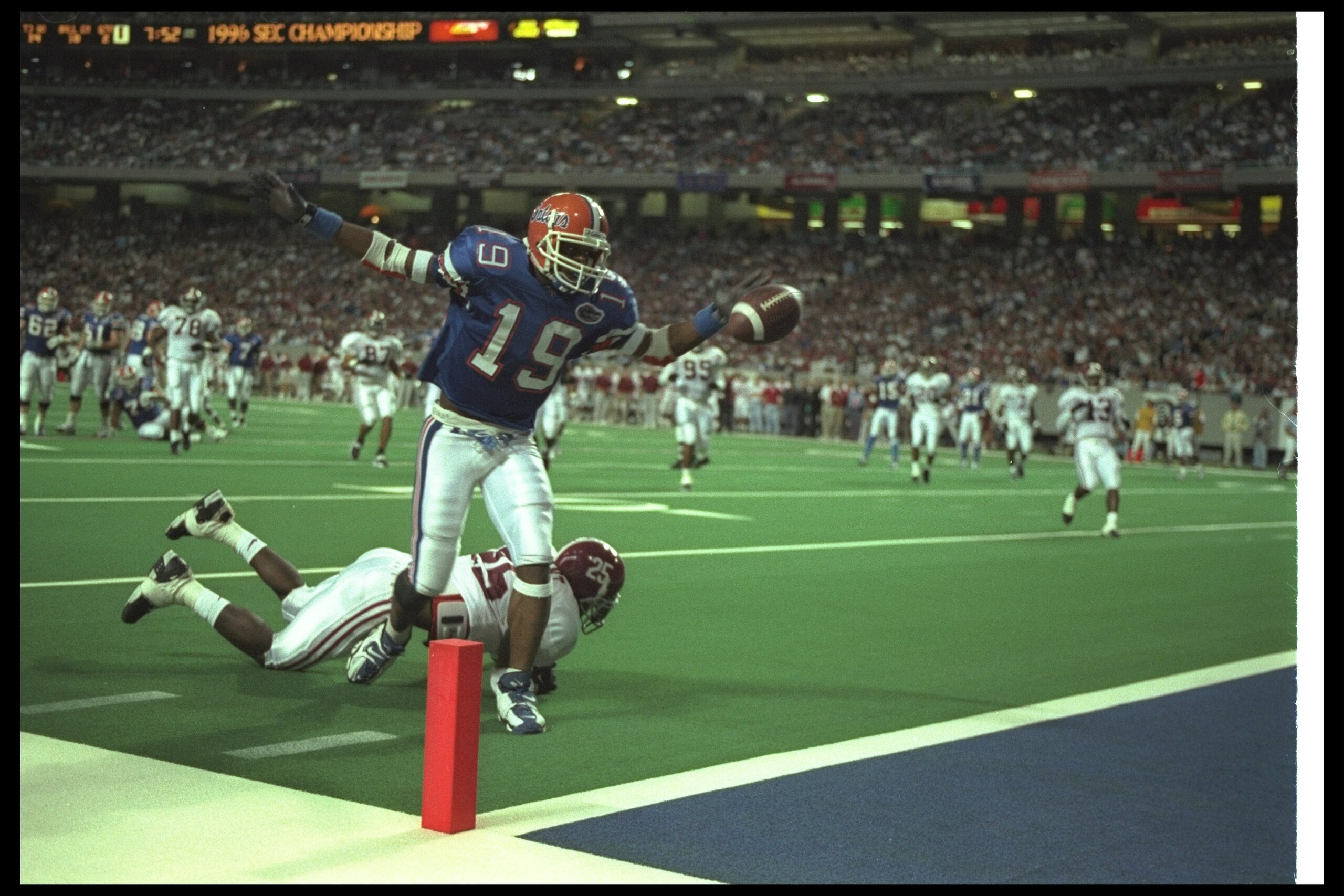 7 Dec 1996:  Wide receiver Ike Hilliard of the Florida Gators celebrates as he scores a touchdown during the SEC Championship game against the Alabama Crimson Tide at the Georgia Dome in Atlanta, Georgia.  Florida won the game, 45-30. Mandatory Credit: Ma