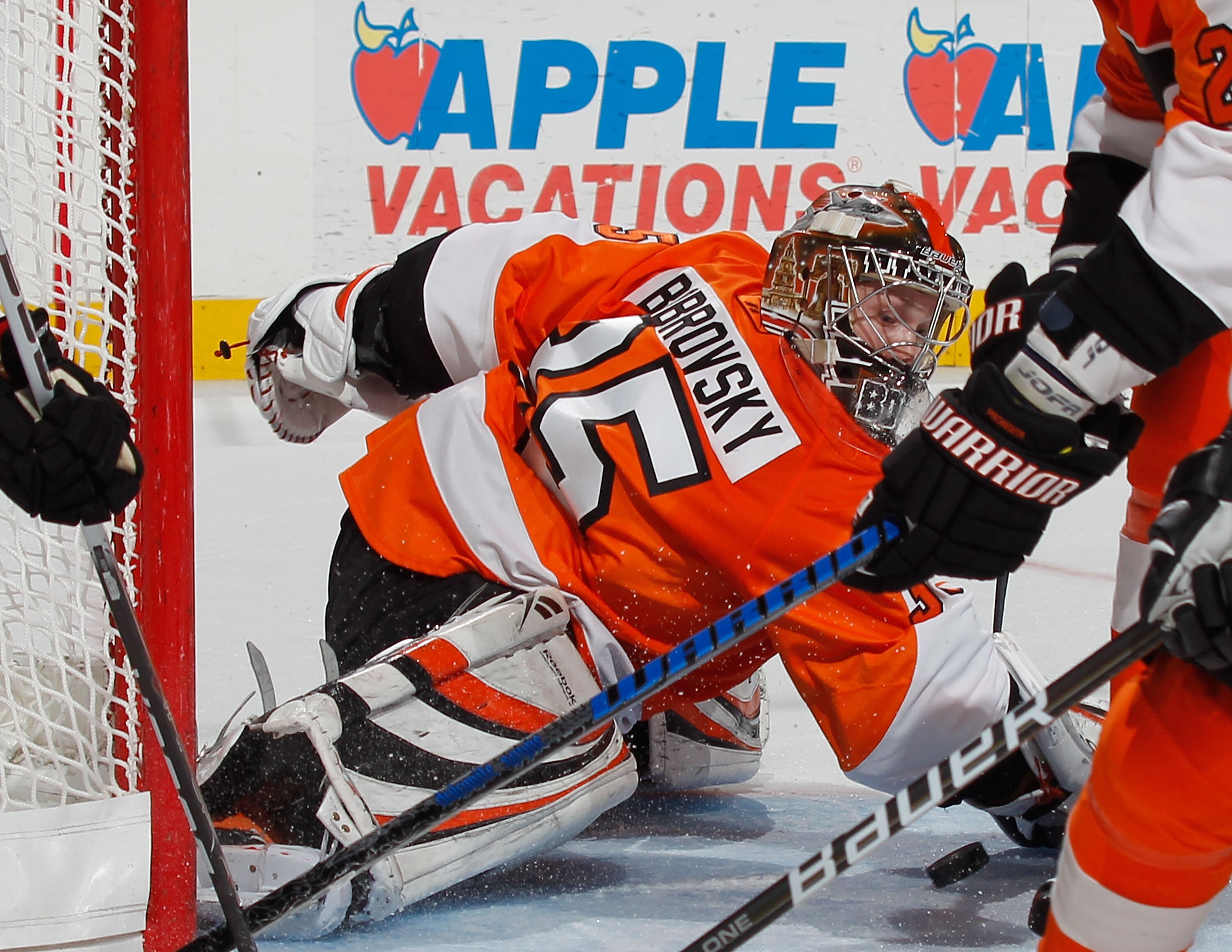 PHILADELPHIA - NOVEMBER 26:  Goalie Sergei Bobrovsky #35 of the Philadelphia Flyers covers a loose puck during the first period of a hockey game against the Calgary Flames at the Wells Fargo Center on November 26, 2010 in Philadelphia, Pennsylvania.  (Pho