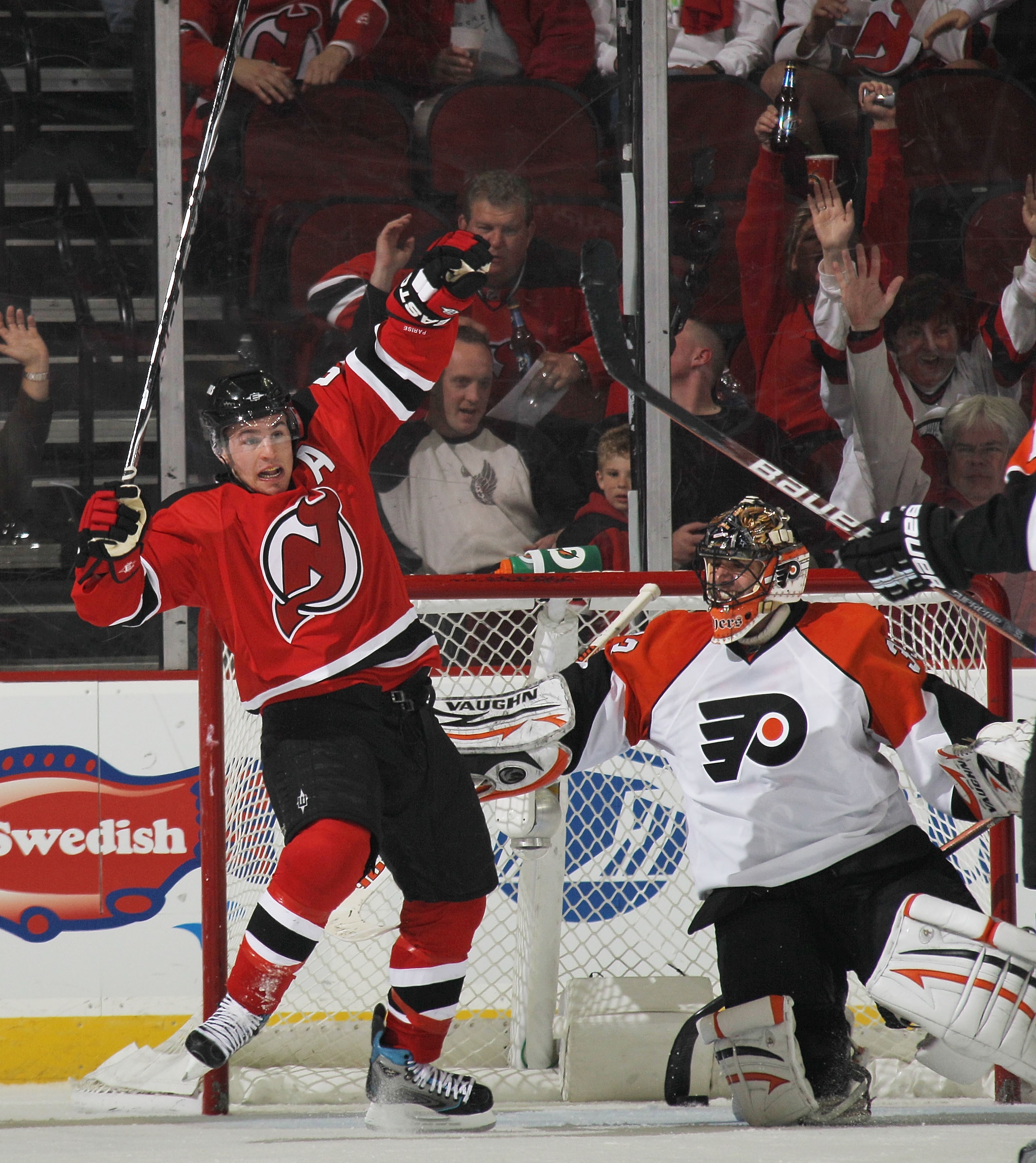 NEWARK, NJ - APRIL 14: Zach Parise #9 of the New Jersey Devils celebrates a goal by Travis Zajac #19 (not shown) against Brian Boucher #33 of the Philadelphia Flyers in Game One of the Eastern Conference Quarterfinals during the 2010 NHL Stanley Cup Playo