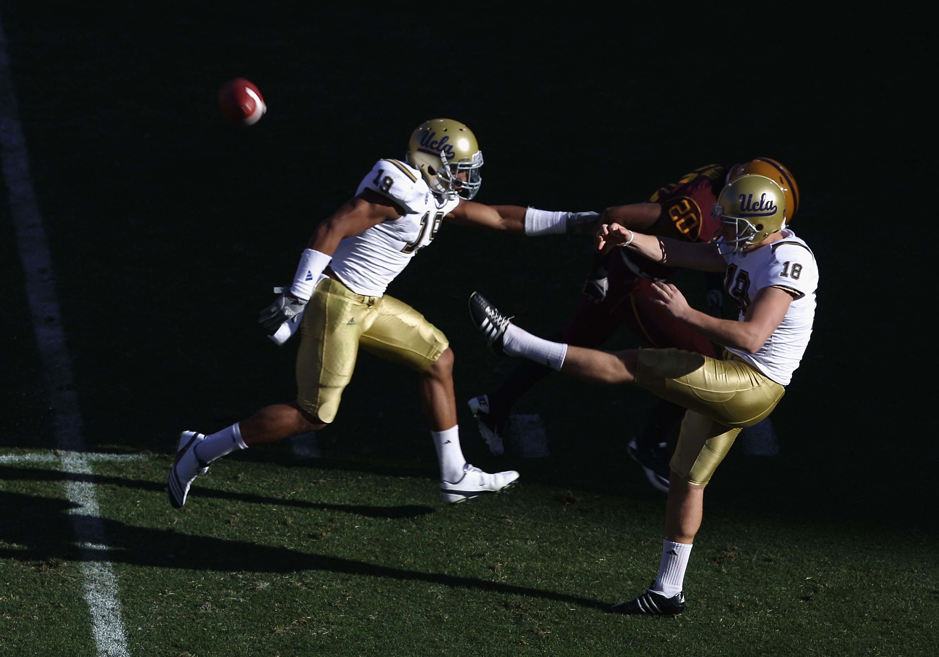 TEMPE, AZ - NOVEMBER 26:  Kicker Jeff Locke #18 of the UCLA Bruins punts the ball during the college football game against the Arizona State Sun Devils at Sun Devil Stadium on November 26, 2010 in Tempe, Arizona.  The Sun Devils defeated the Bruins 55-34.