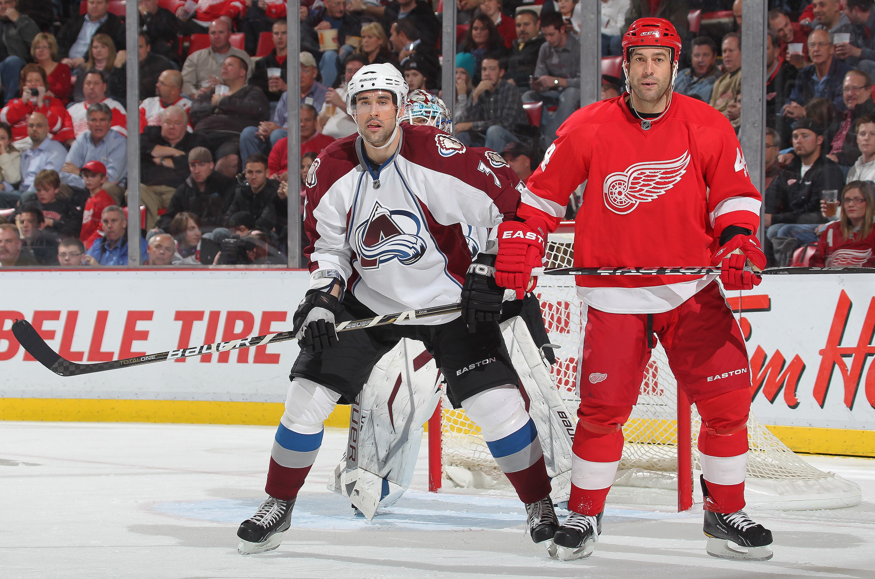 DETROIT,MI - NOVEMBER 13:  Todd Bertuzzi #44 of the Detroit Red Wings is watched by Ryan O'Byrne #3 of the Colorado Avalanche in a game on November 13,2010 at the Joe Louis Arena in Detroit, Michigan. The Wings defeated the Avalanche 3-1. (Photo by Claus 