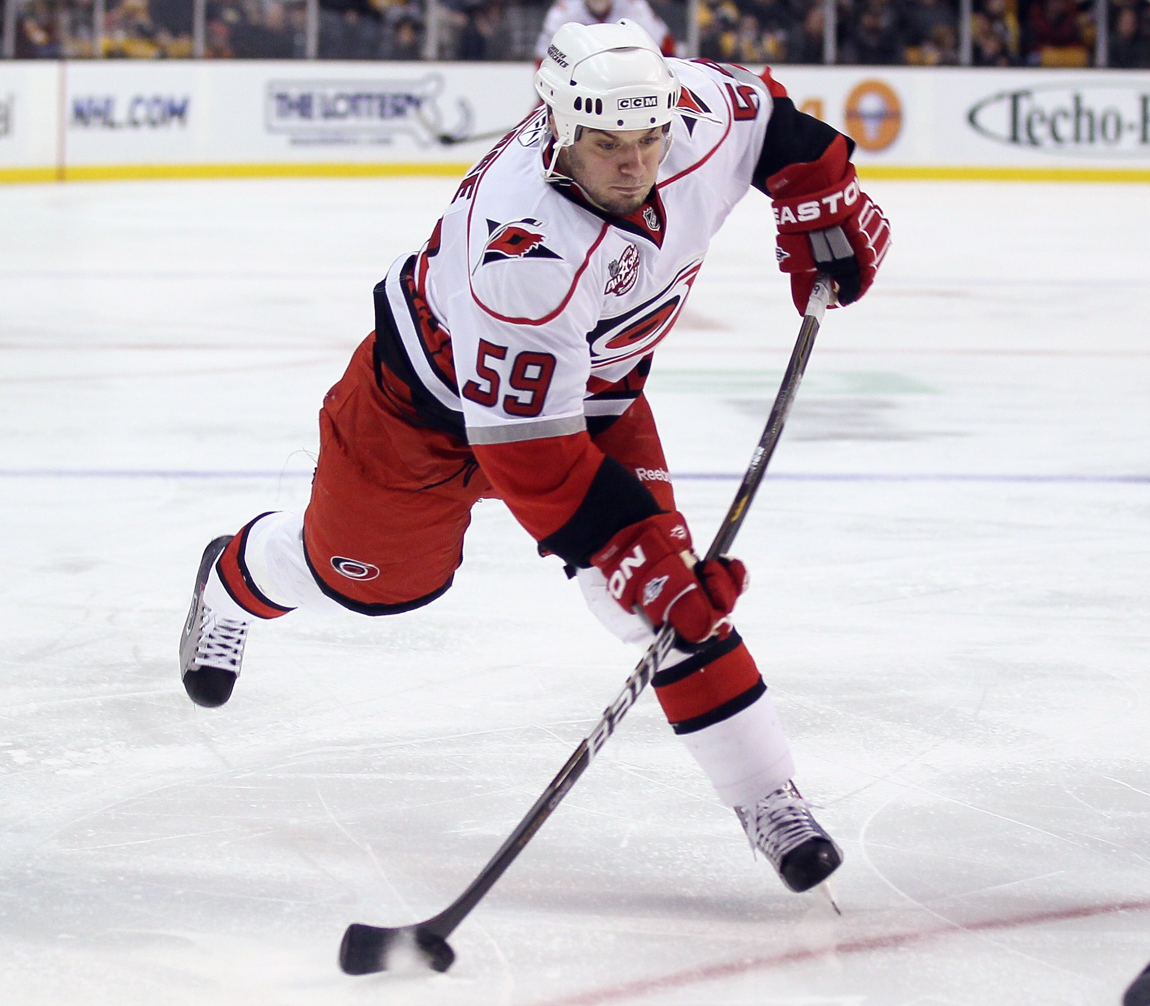 BOSTON - NOVEMBER 26:  Chad LaRose #59 of the Carolina Hurricanes takes a shot in the second period against the Boston Bruins on November 26, 2010 at the TD Garden in Boston, Massachusetts.  (Photo by Elsa/Getty Images)