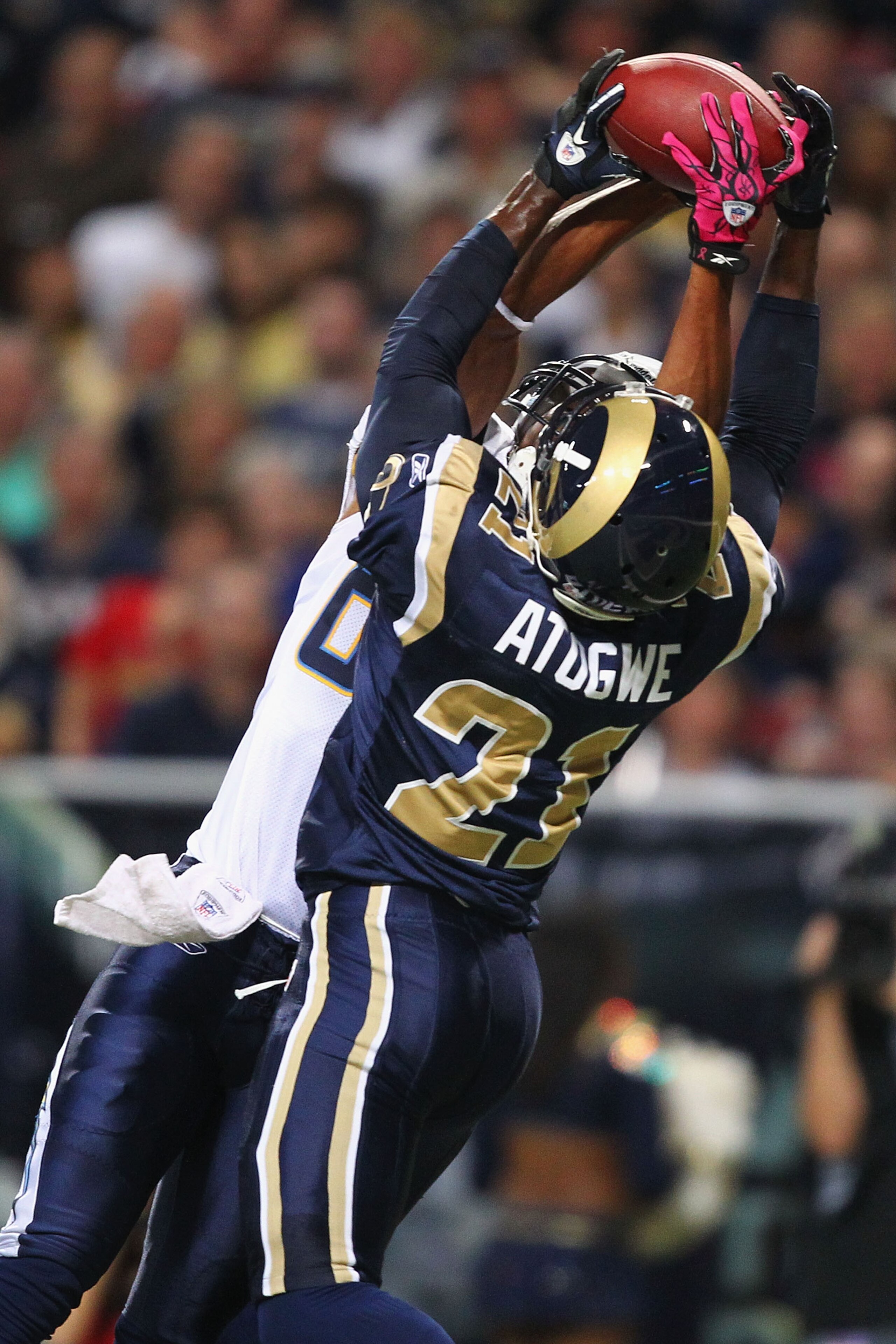 ST. LOUIS - OCTOBER 17: Oshiomogho Atogwe #21 of the St. Louis Rams intercepts a pass against the San Diego Chargers at the Edward Jones Dome on October 17, 2010 in St. Louis, Missouri.  The Rams beat the Chargers 20-17.  (Photo by Dilip Vishwanat/Getty I