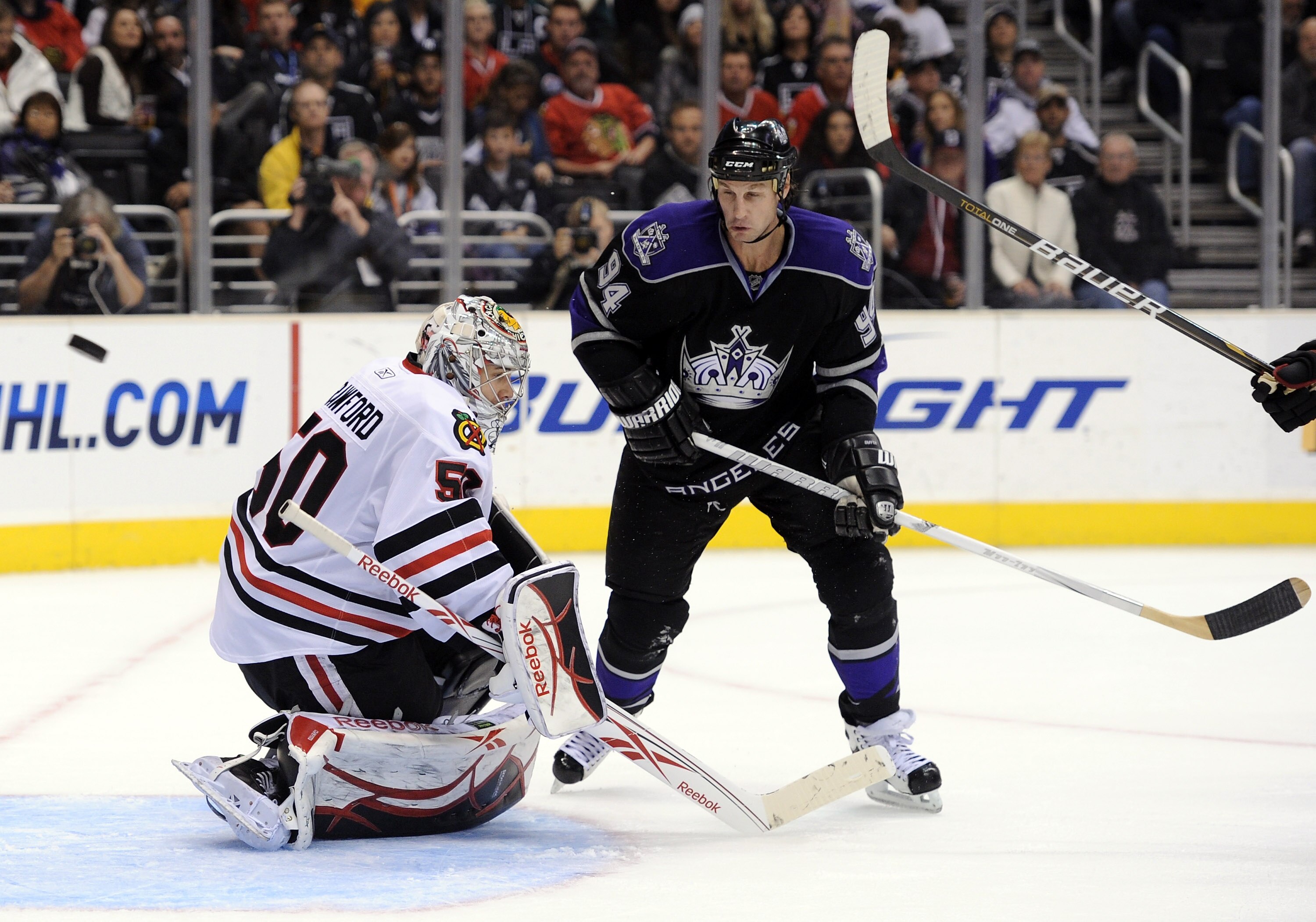LOS ANGELES, CA - NOVEMBER 27:  Corey Crawford #50 of the Chicago Blackhawks makes a save in front of Ryan Smyth #94 of the Los Angeles Kings during the second period at Staples Center on November 27, 2010 in Los Angeles, California.  (Photo by Harry How/