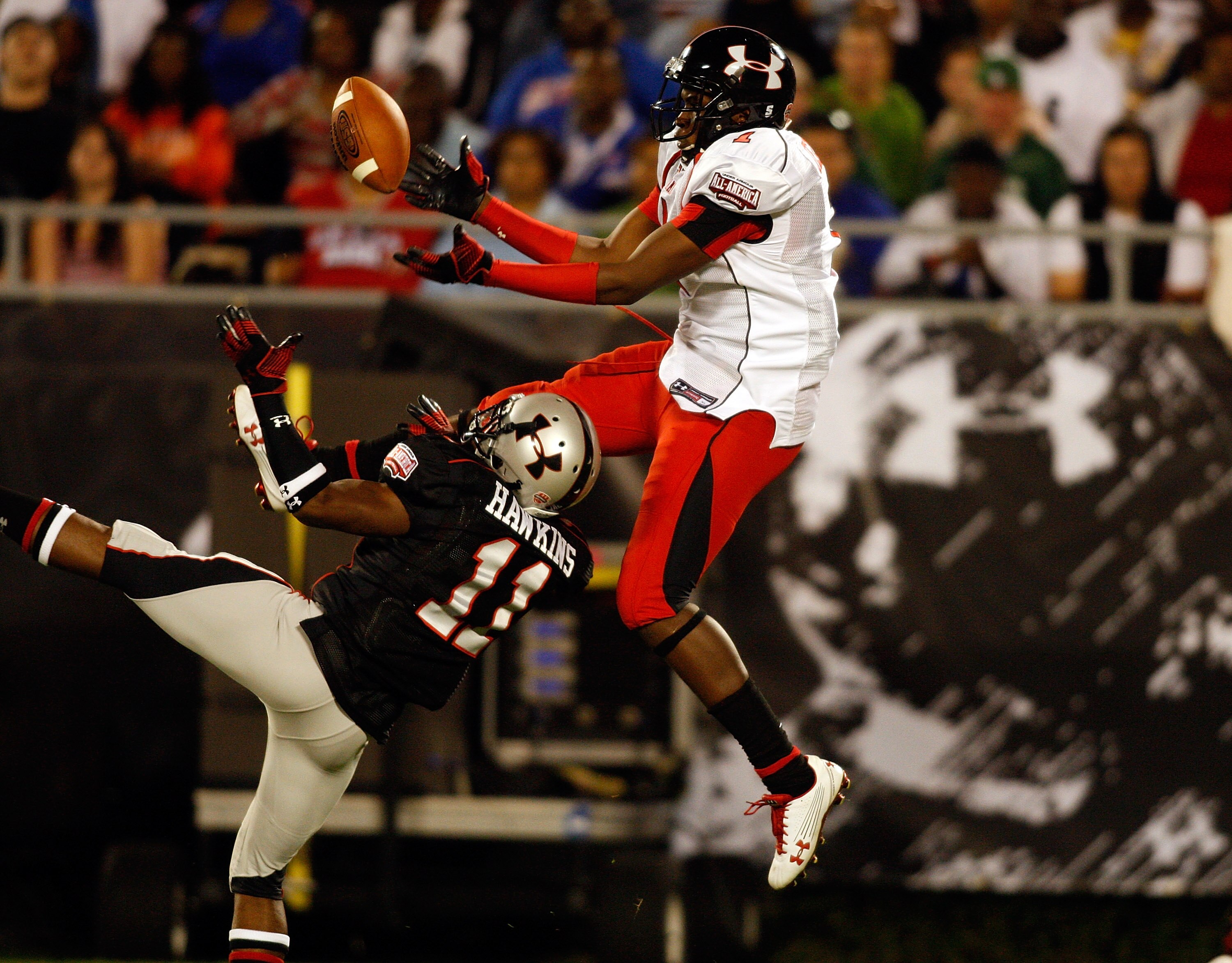 ORLANDO, FL - JANUARY 04:  Receiver Alshon Jeffrey #1 hauls in a pass as cornerback Travis Hawkins #11 looks to break up the pass during the All America Under Armour Football Game at the Florida Citrus Bowl on January 4, 2009 in Orlando, Florida.  (Photo 
