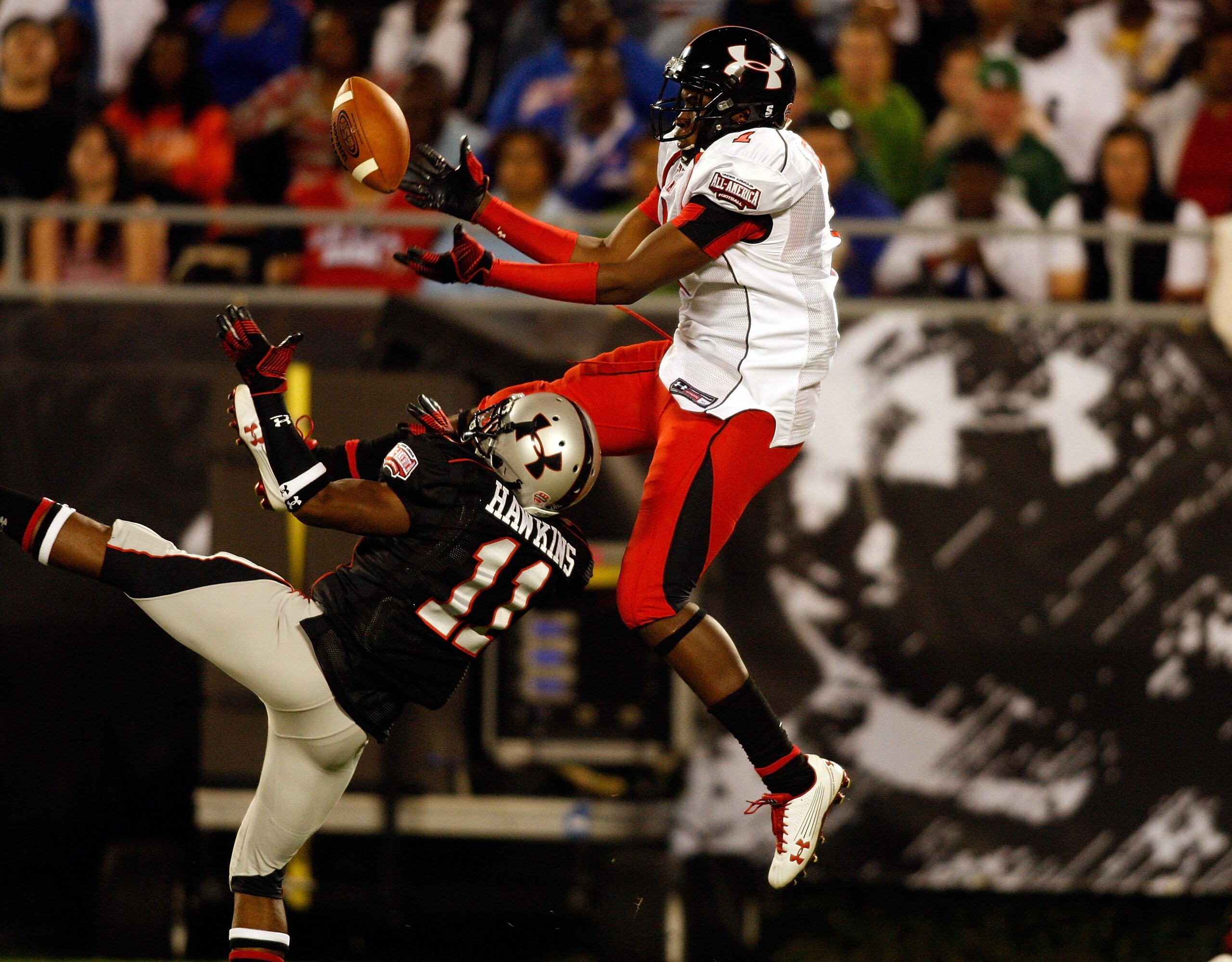 ORLANDO, FL - JANUARY 04:  Receiver Alshon Jeffrey #1 hauls in a pass as cornerback Travis Hawkins #11 looks to break up the pass during the All America Under Armour Football Game at the Florida Citrus Bowl on January 4, 2009 in Orlando, Florida.  (Photo 