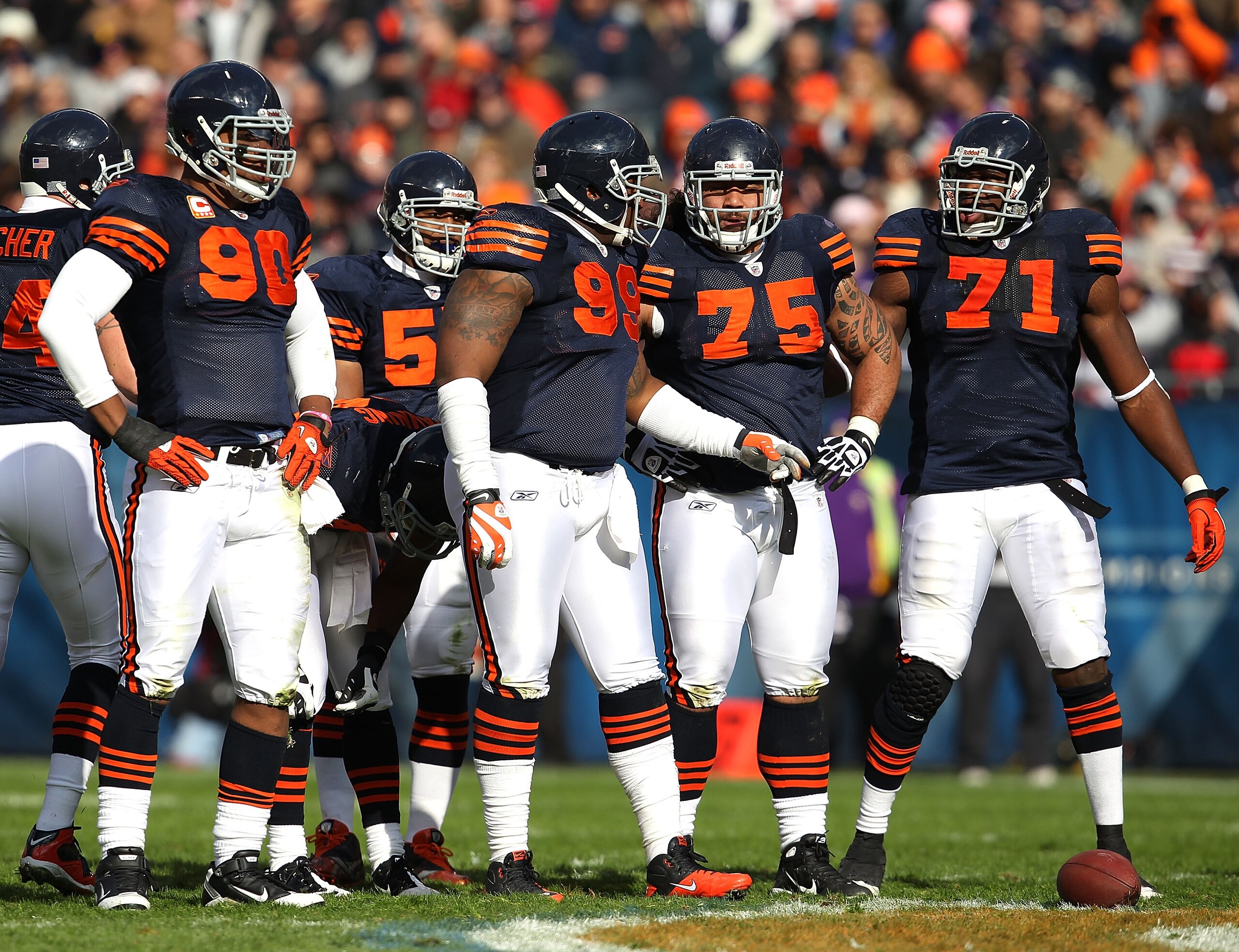 CHICAGO - NOVEMBER 14: Members of the Chicago Bear defense including (L-R) Julius Peppers #90, Lance Briggs #55, Marcus Harrison #99, Matt Toeaina #75 and Israel Idonije #71 await the start of play against the Minnesota Vikings at Soldier Field on Novembe