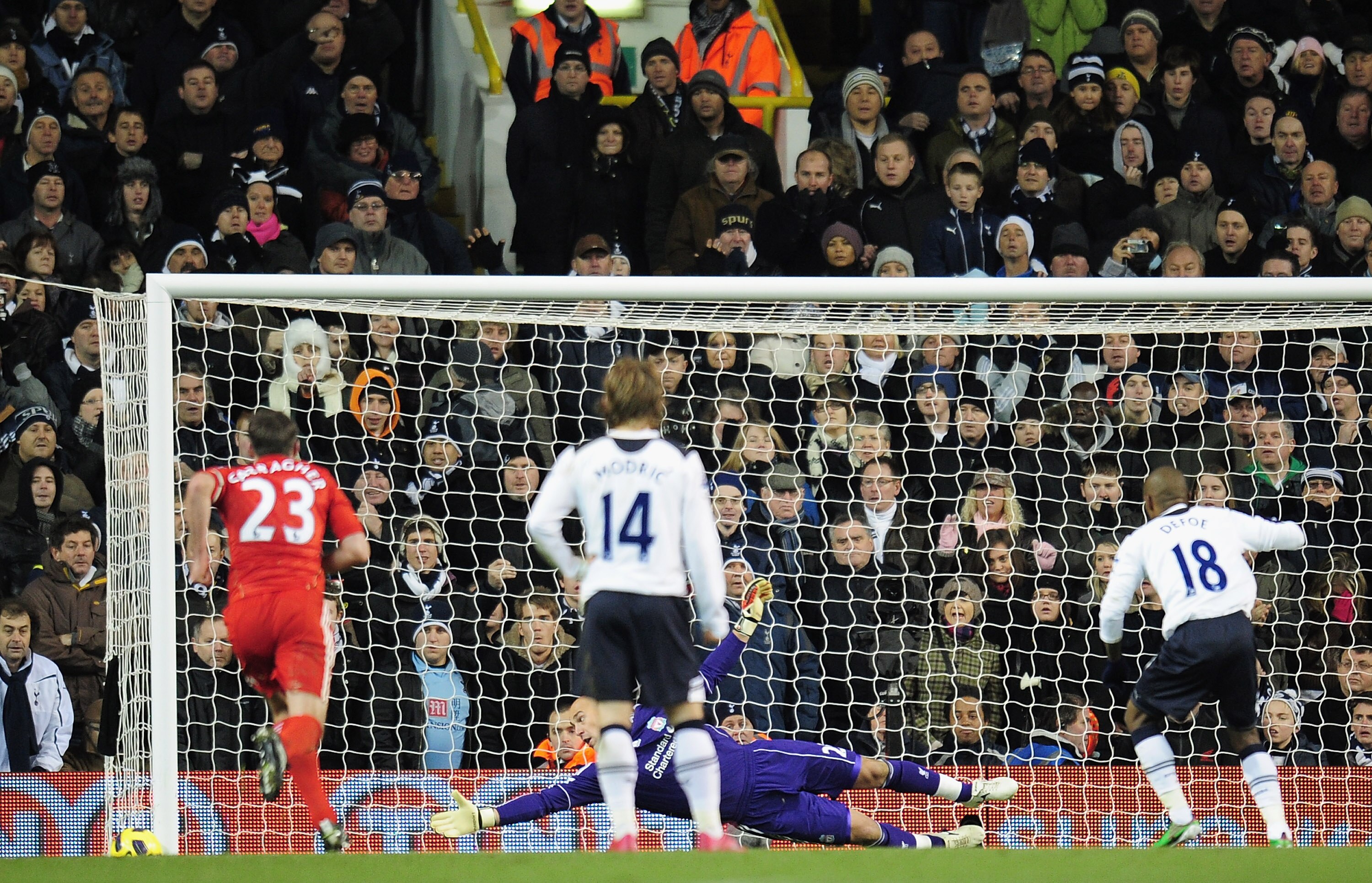 LONDON, ENGLAND - NOVEMBER 28:  Jose Reina of Liverpool watches the ball go wide as Jermain Defoe of Tottenham Hotspur misses a penalty during the Barclays Premier League match between Tottenham Hotspur and Liverpool at White Hart Lane on November 28, 201