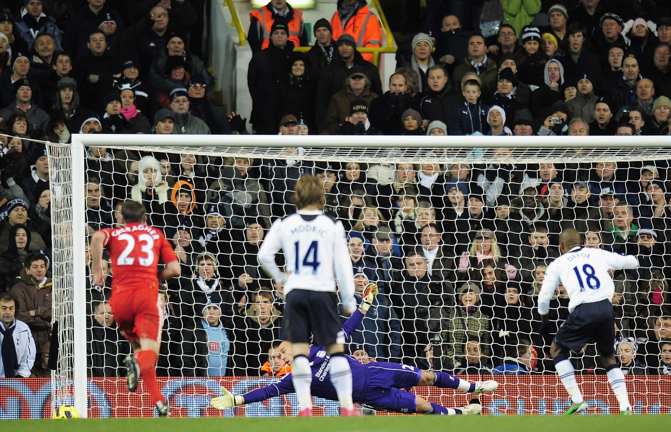 LONDON, ENGLAND - NOVEMBER 28:  Jose Reina of Liverpool watches the ball go wide as Jermain Defoe of Tottenham Hotspur misses a penalty during the Barclays Premier League match between Tottenham Hotspur and Liverpool at White Hart Lane on November 28, 201