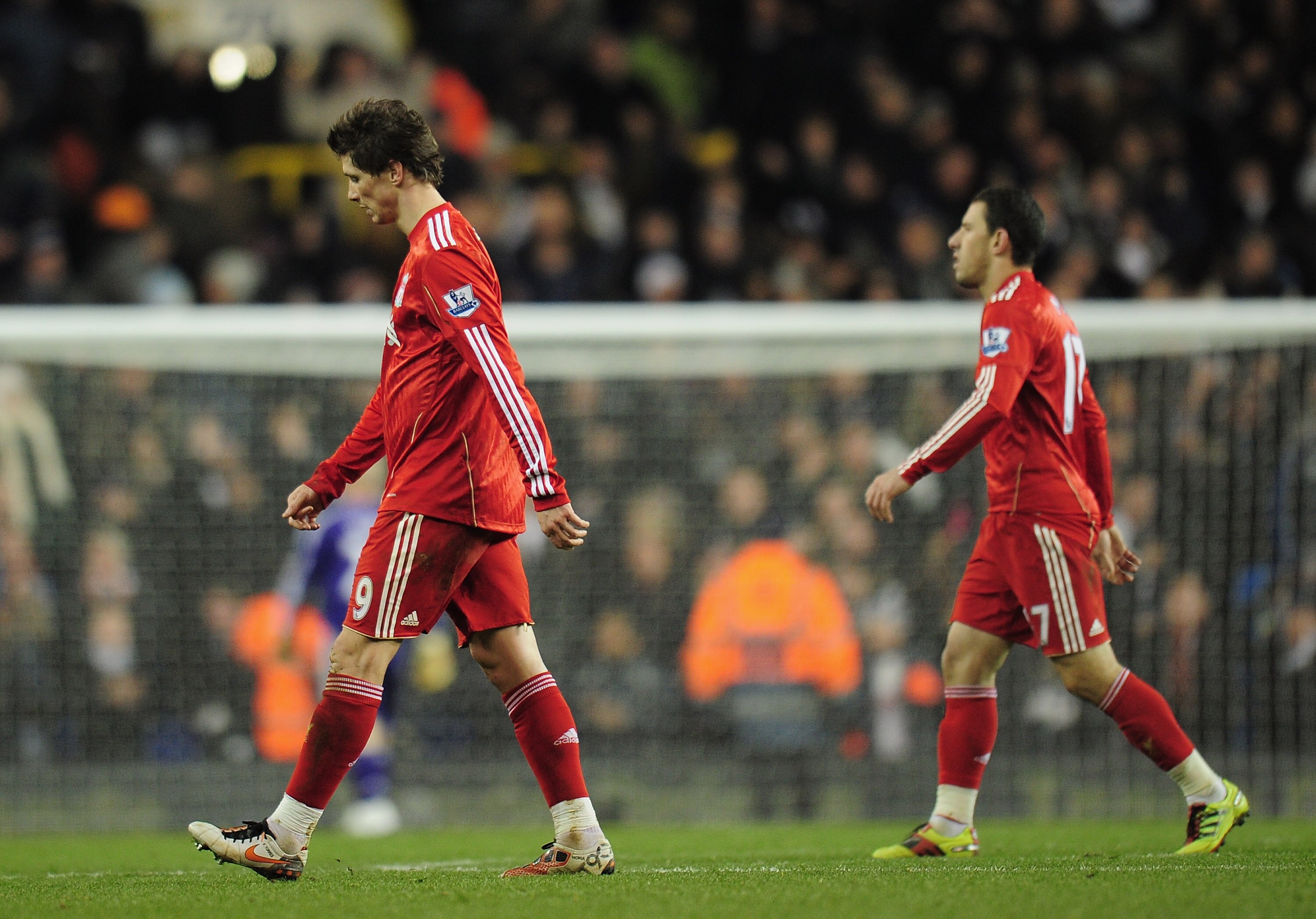LONDON, ENGLAND - NOVEMBER 28:  Fernando Torres and Rodriguez Maxi of Liverpool walk off the pitch dejected after defeat in the Barclays Premier League match between Tottenham Hotspur and Liverpool at White Hart Lane on November 28, 2010 in London, Englan