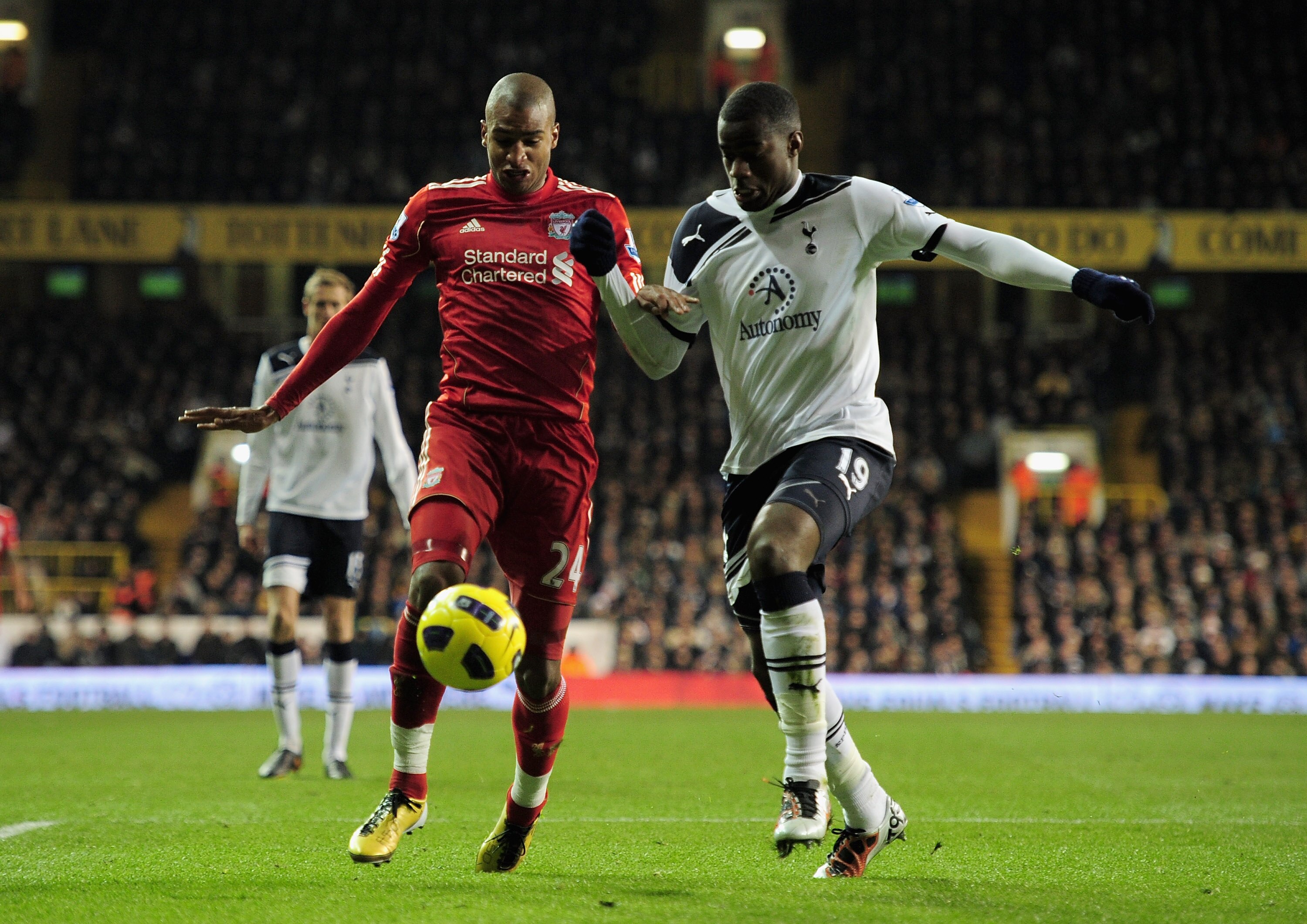 LONDON, ENGLAND - NOVEMBER 28:  David Ngog of Liverpool and Sebastien Bassong of Tottenham Hotspur battle for the ball during the Barclays Premier League match between Tottenham Hotspur and Liverpool at White Hart Lane on November 28, 2010 in London, Engl