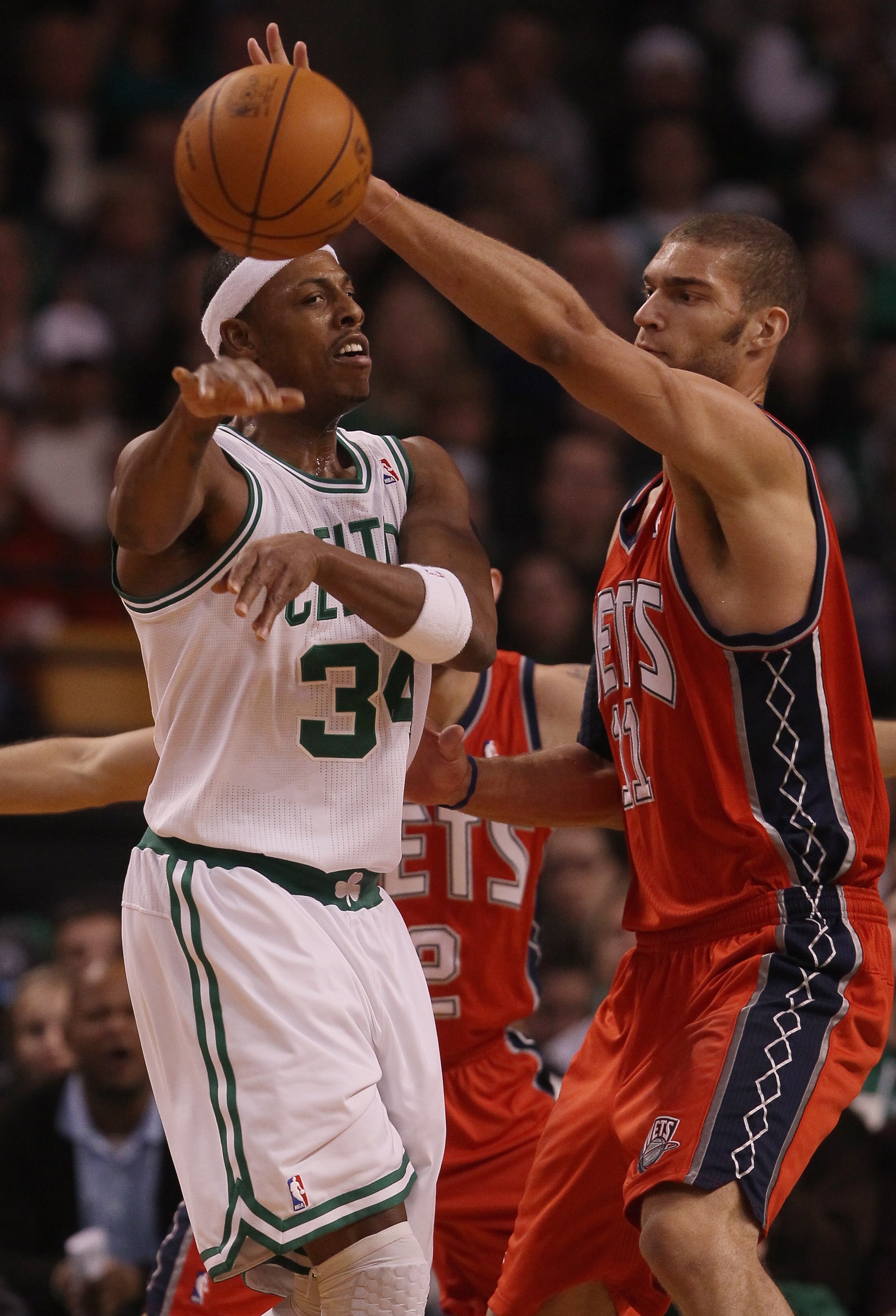 BOSTON - NOVEMBER 24:  Paul Pierce #34 of the Boston Celtics tries to pass around Brook Lopez #11 of the New Jersey Nets on November 24, 2010 at the TD Garden in Boston, Massachusetts. The Celtics defeated the nets 89-83. NOTE TO USER: User expressly ackn