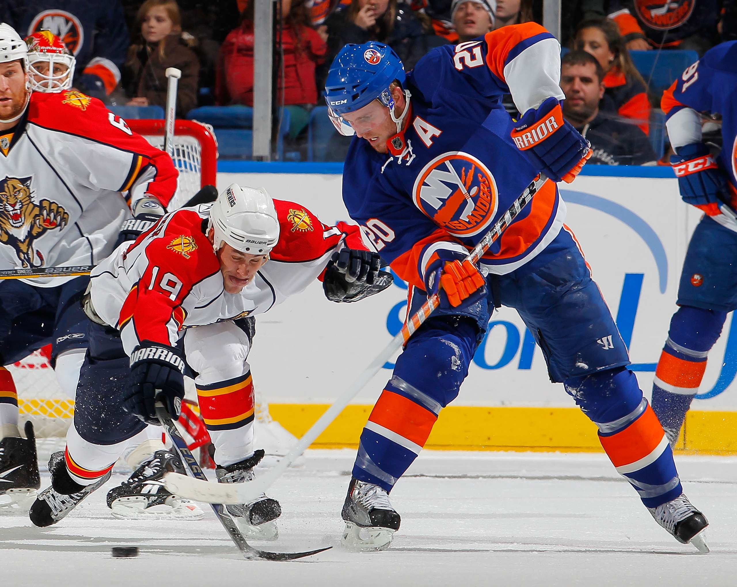 UNIONDALE, NY - NOVEMBER 20: Marty Reasoner #19 of the Florida Panthers defends against James Wisniewski #20 of the New York Islanders late in the first period of a hockey game at the Nassau Coliseum on November 20, 2010 in Uniondale, New York. (Photo b UNIONDALE, NY - NOVEMBER 20: Marty Reasoner #19 of the Florida Panthers defends against James Wisniewski #20 of the New York Islanders late in the first period of a hockey game at the Nassau Coliseum on November 20, 2010 in Uniondale, New York. (Photo b