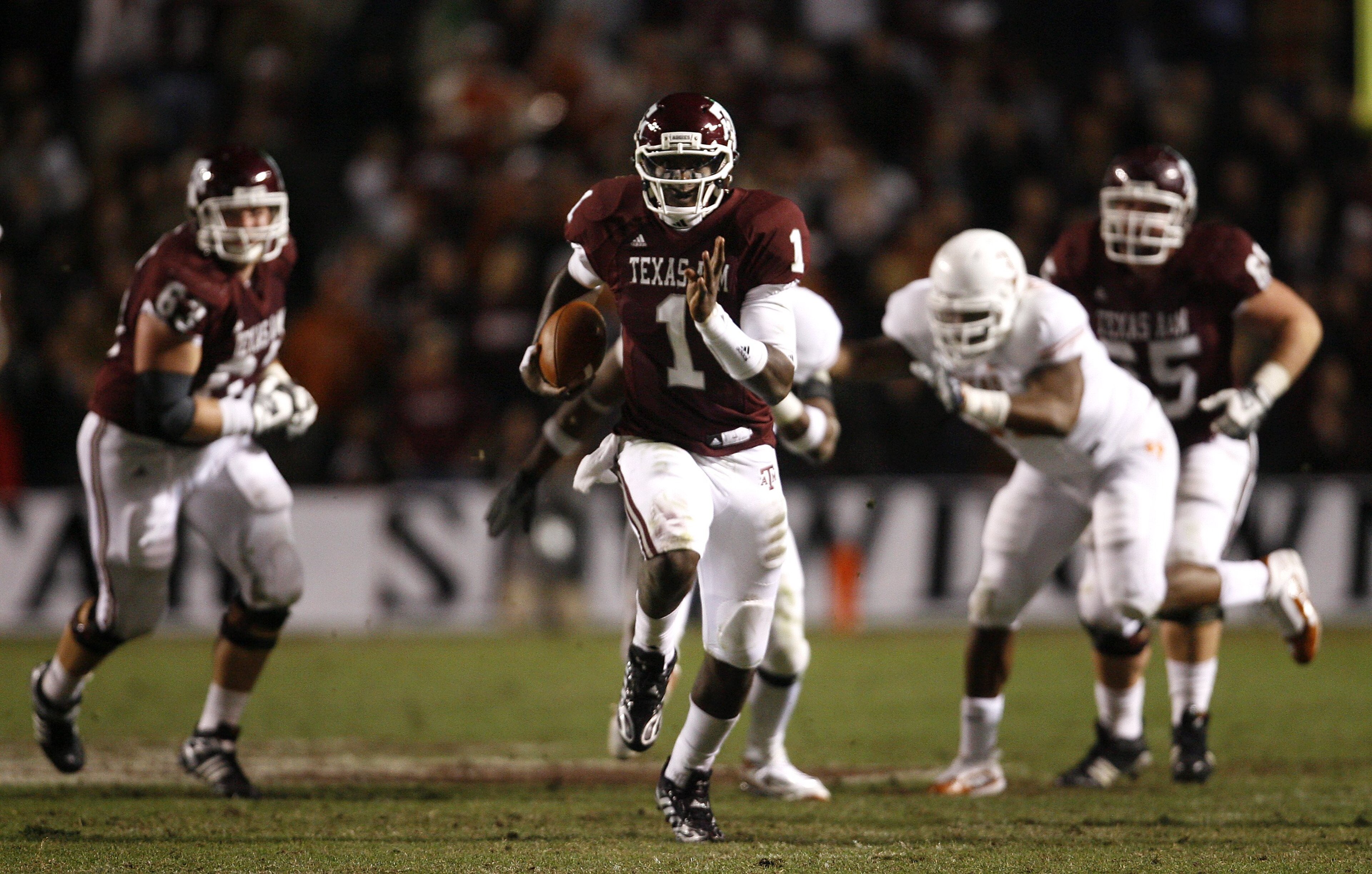 COLLEGE STATION, TX - NOVEMBER 26: Quarterback Jerrod Johnson #1 of the Texas A&M Aggies scrambles for a gain against the Texas Longhorns in the second half at Kyle Field on November 26, 2009 in College Station, Texas. The Longhorns defeated the Aggies 49 COLLEGE STATION, TX - NOVEMBER 26: Quarterback Jerrod Johnson #1 of the Texas A&M Aggies scrambles for a gain against the Texas Longhorns in the second half at Kyle Field on November 26, 2009 in College Station, Texas. The Longhorns defeated the Aggies 49