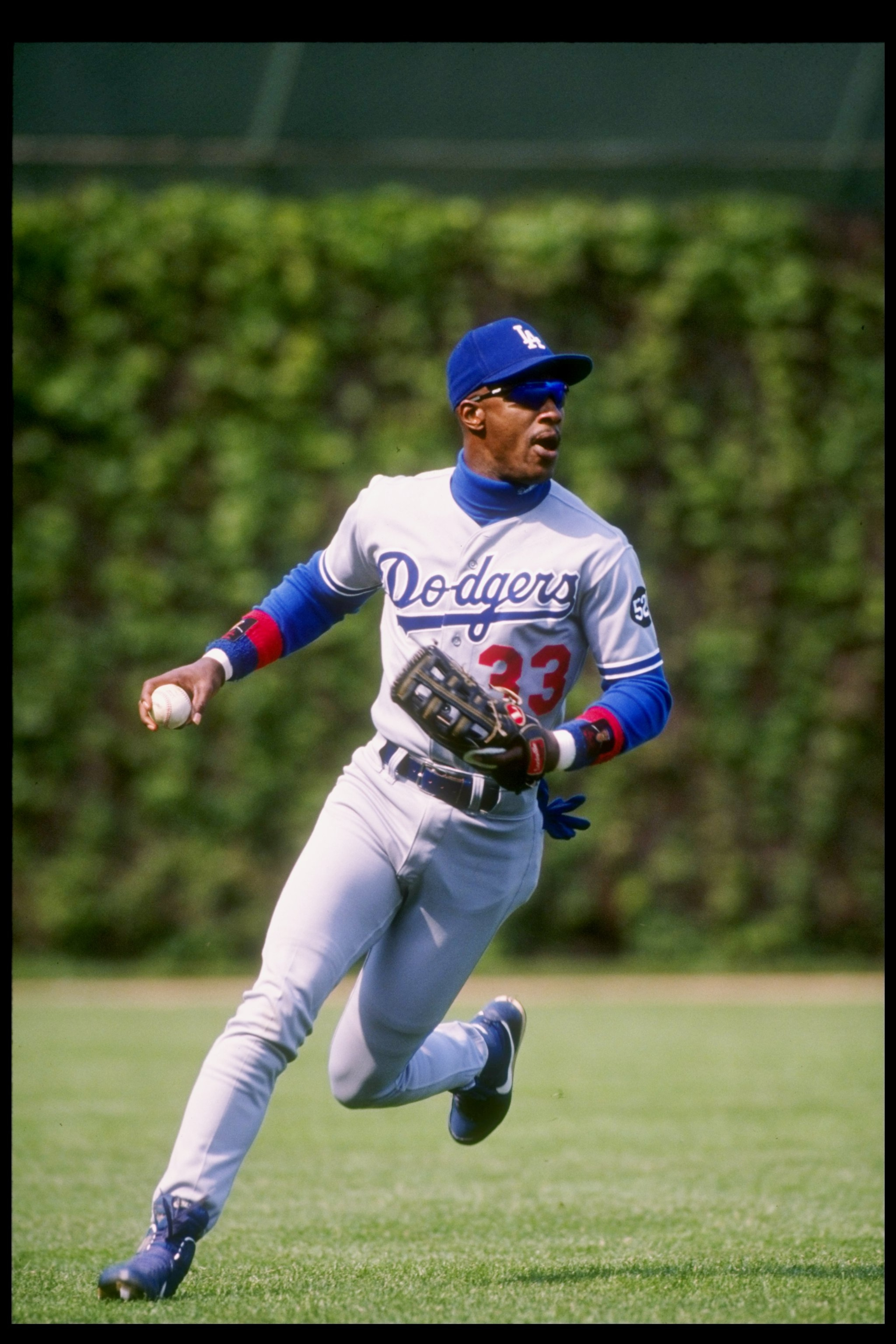 11 May 1993: Outfielder Eric Davis of the Los Angeles Dodgers looks to throw the ball during a game against the Chicago Cubs at Wrigley Field in Chicago, Illinois. Mandatory Credit: Jonathan Daniel /Allsport 11 May 1993: Outfielder Eric Davis of the Los Angeles Dodgers looks to throw the ball during a game against the Chicago Cubs at Wrigley Field in Chicago, Illinois. Mandatory Credit: Jonathan Daniel /Allsport