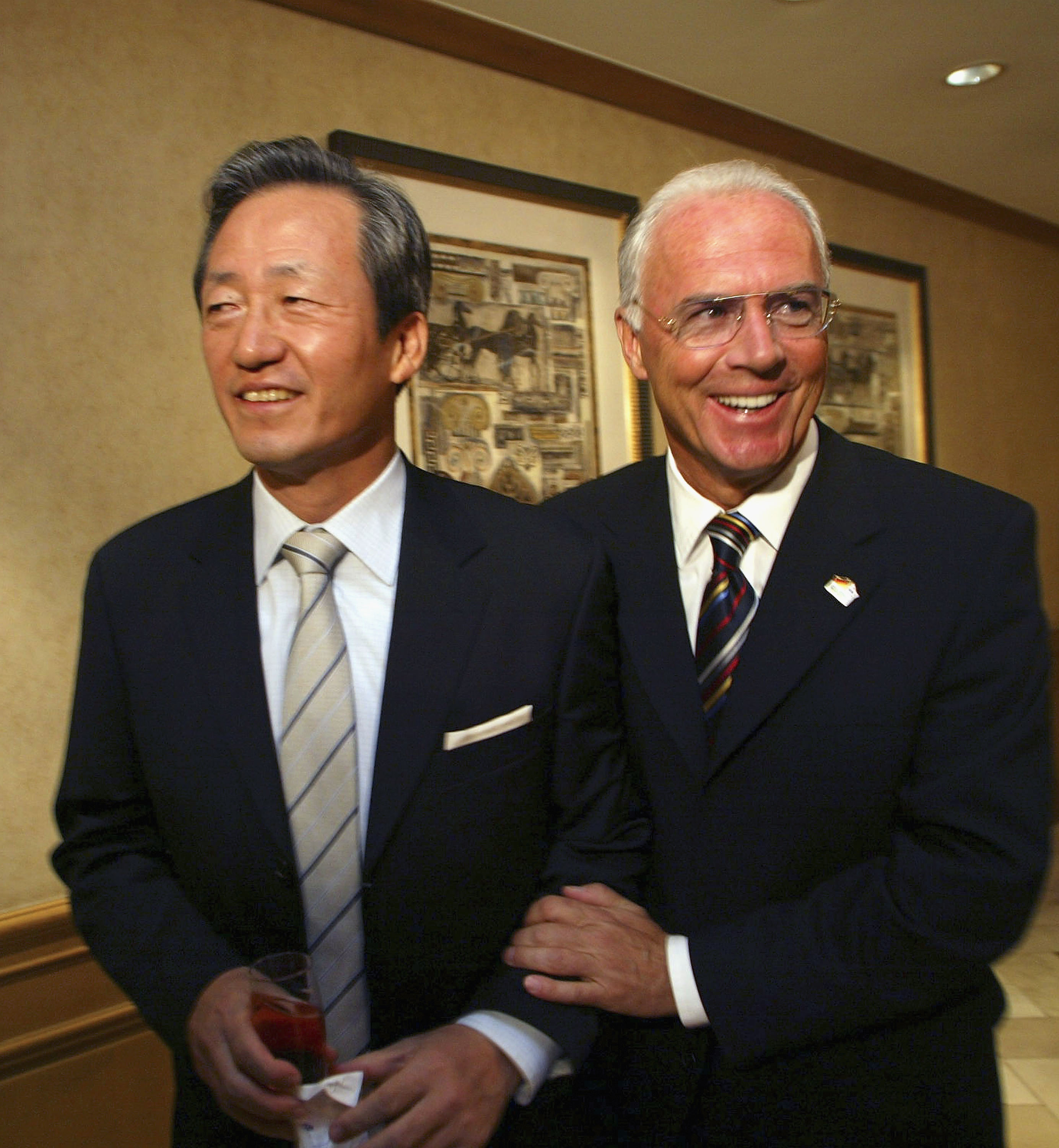 SEOUL, SOUTH KOREA - OCTOBER 5: Franz Beckenbauer (R), president of the 2006 Football World Cup organizing committee, jokes with Chung Mong-Joon, president of KFA (Korea Football Association) before a presentation session for 2006 Football World Cup on Oc