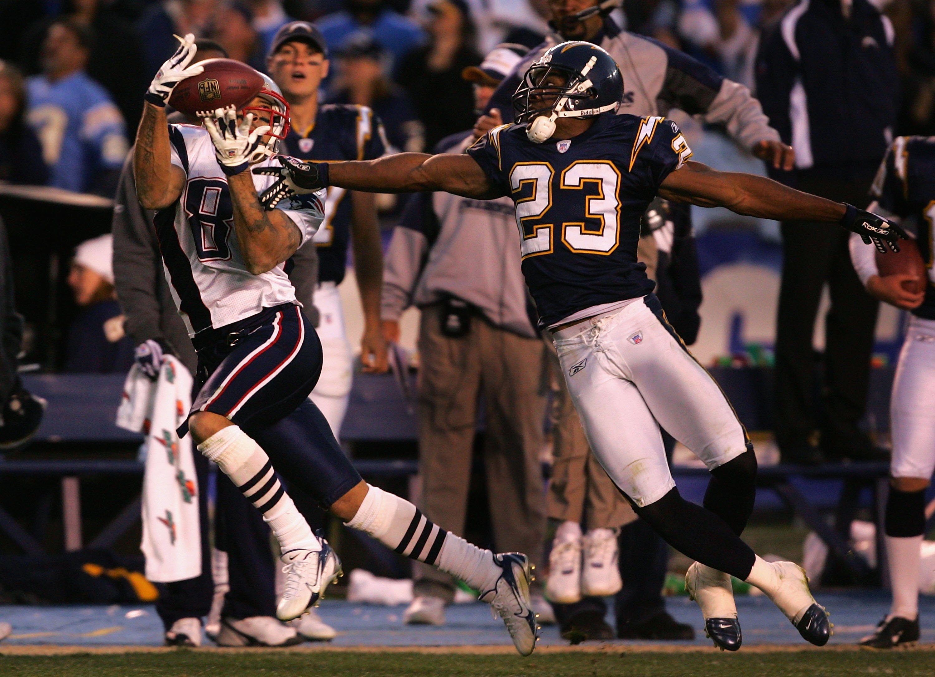 SAN DIEGO - JANUARY 14:  Wide receiver Reche Caldwell #87 of the New England Patriots catches a 49 yard reception past Quentin Jammer #23 of the San Diego Chargers during the AFC Divisional Playoff Game held at Qualcomm Stadium January 14, 2007 in San Die