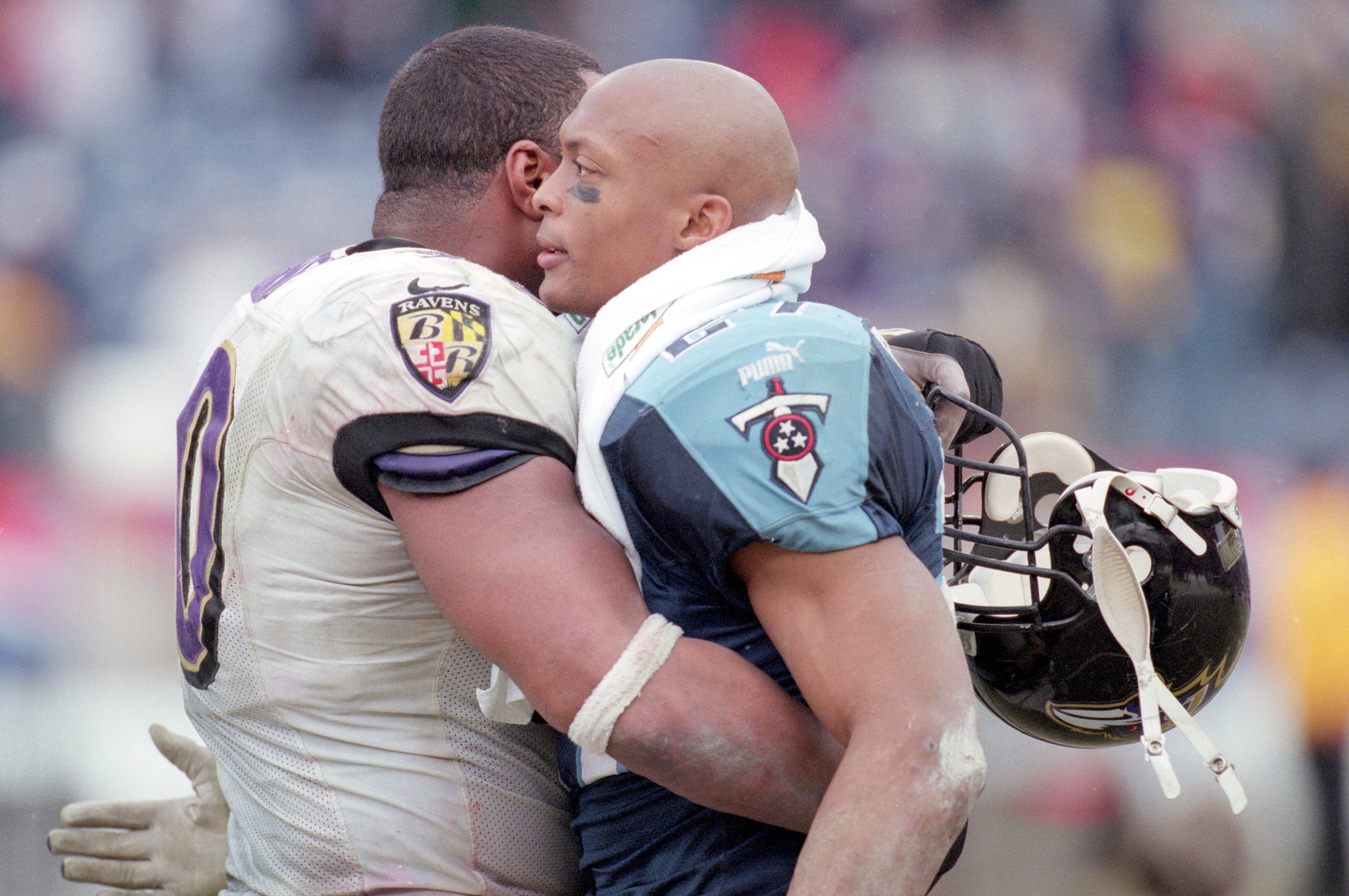 7 Jan 2001:  Eddie George #27 of the Tennessee Titans hugs Rob Burnett #90 of the Baltimore Ravens during the AFC Divisional Playoffs Game at the Adelphia Coliseum in Nashville, Tennessee.  The Ravens defeated the Titans 24-10.Mandatory Credit: Jonathan D