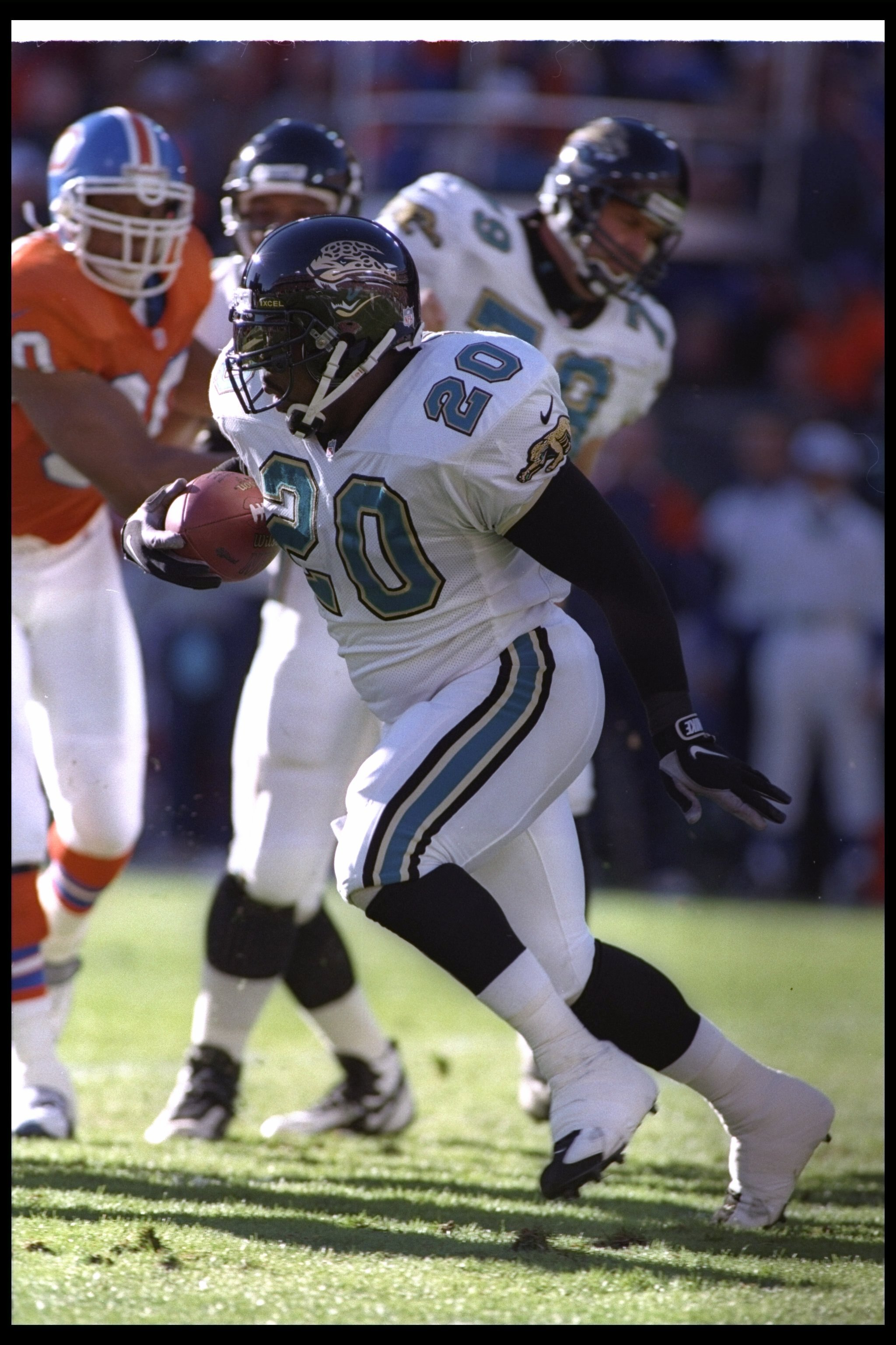4 Jan 1997:  Running back Natrone Means of the Jacksonville Jaguars moves the ball during a playoff game against the Denver Broncos at Mile High Stadium in Denver, Colorado.  The Jaguars won the game, 30-27. Mandatory Credit: Jamie Squire  /Allsport
