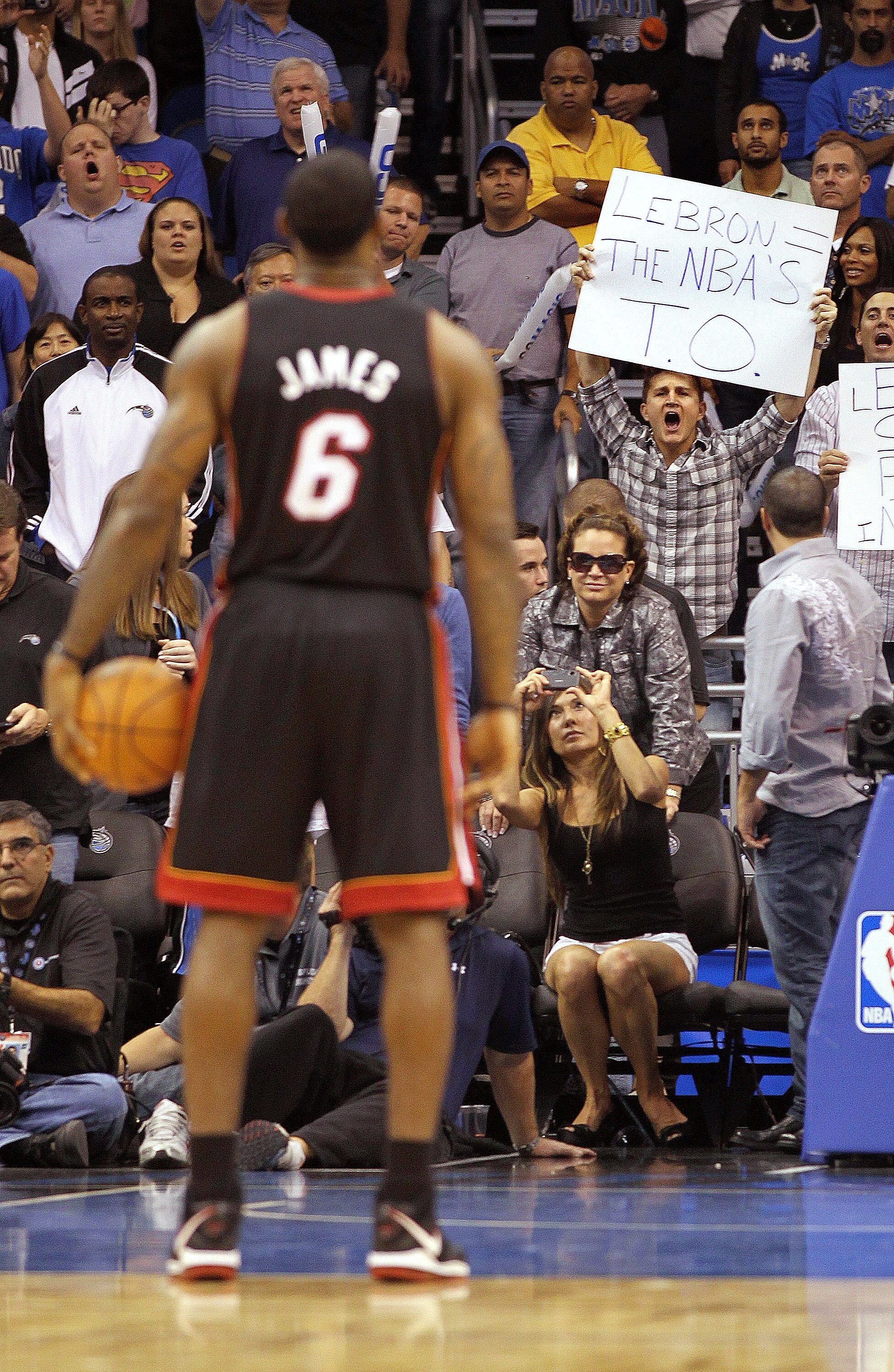 ORLANDO, FL - NOVEMBER 24:  LeBron James #6 of the Miami Heat shoots a foul shot as a fan holds a sign during a game against the Orlando Magic at Amway Arena on November 24, 2010 in Orlando, Florida. NOTE TO USER: User expressly acknowledges and agrees th