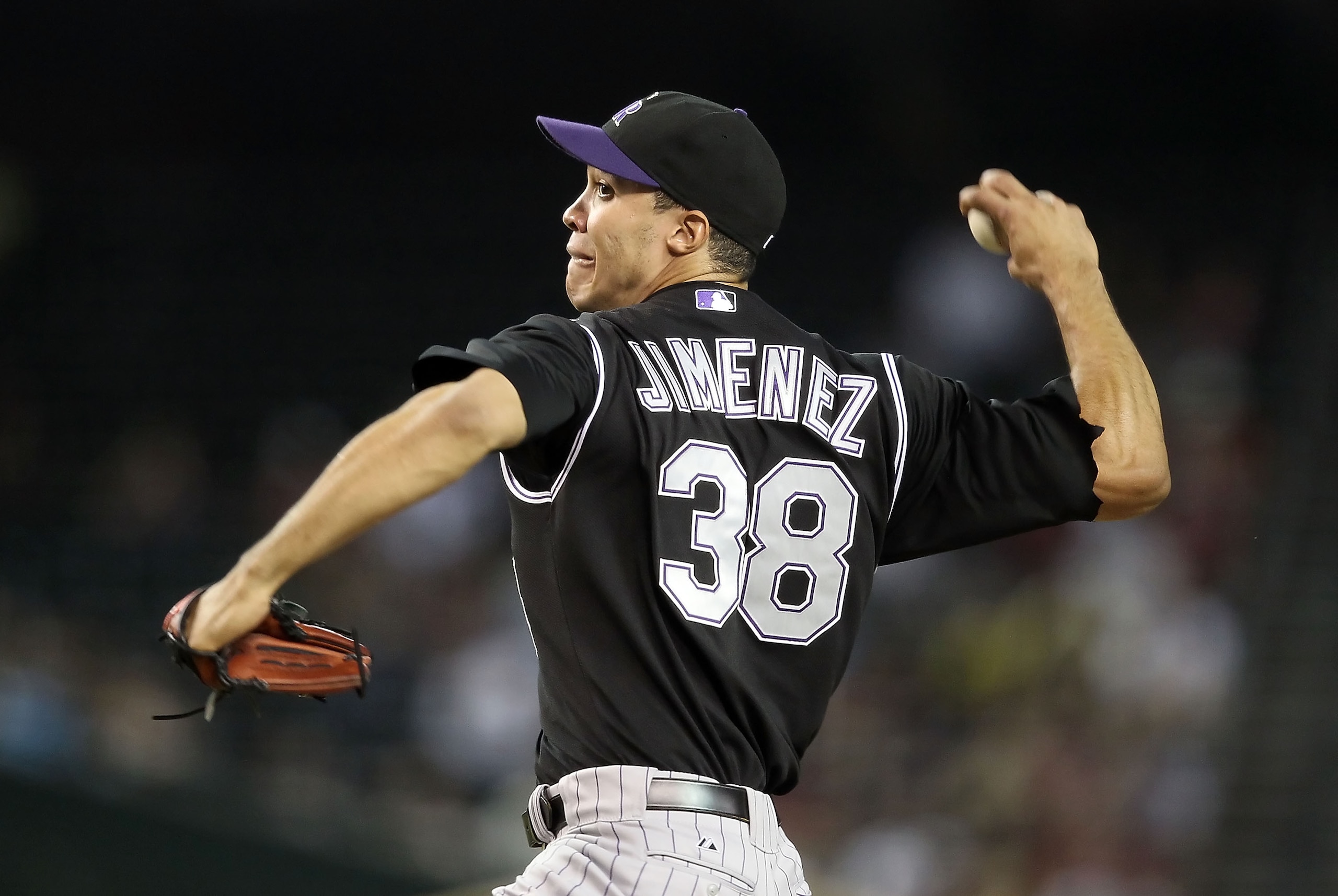 PHOENIX - SEPTEMBER 22:  Starting pitcher Ubaldo Jimenez #38 of the Colorado Rockies pitches against the Arizona Diamondbacks during the Major League Baseball game at Chase Field on September 22, 2010 in Phoenix, Arizona.  (Photo by Christian Petersen/Get