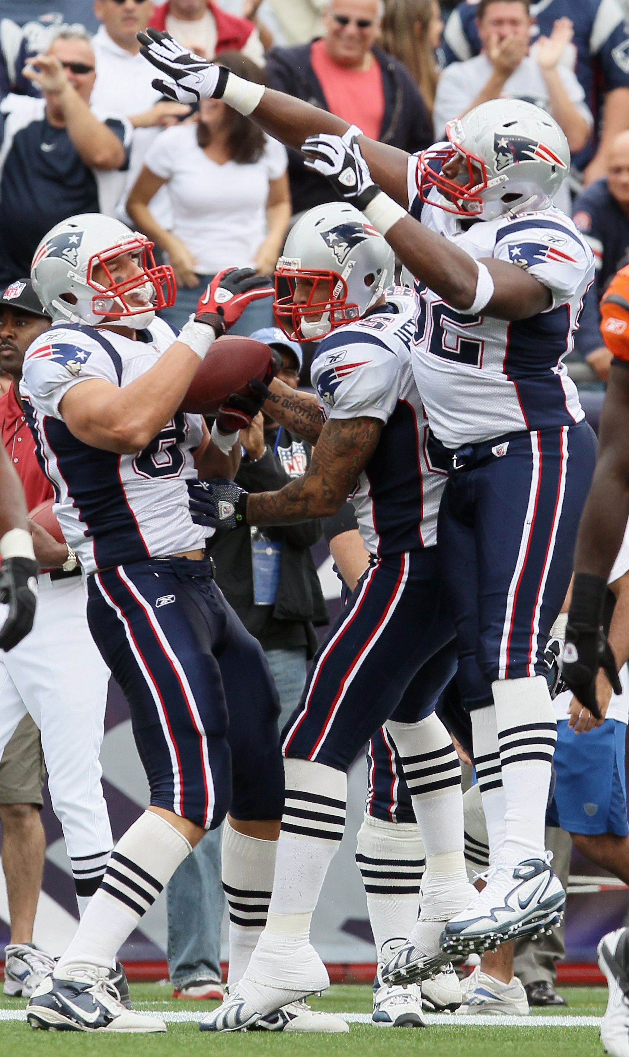 FOXBORO, MA - SEPTEMBER 12:  Rob Gronkowski #87 of the New England Patriots celebrates his touchdown wit teammates Alge Crumpler #82 and Aaron Hernandez #85 in the fourth quarter against the Cincinnati Bengals during the NFL season opener on September 12,