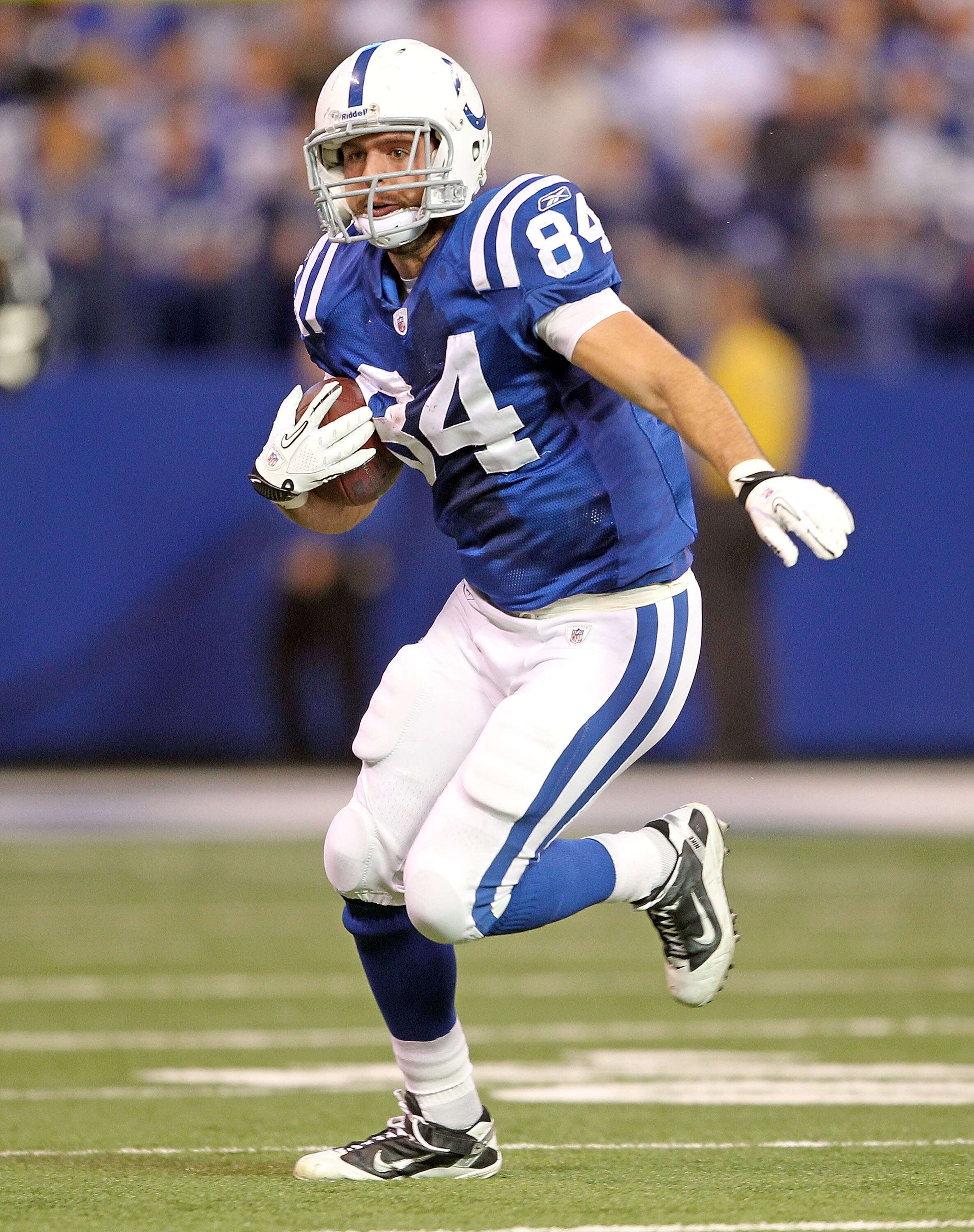 INDIANAPOLIS - NOVEMBER 14:  Jacob Tamme #84 of the Indianapolis Colts runs with the ball after catching a pass during the NFL game against the Cincinnati Bengals at Lucas Oil Stadium on November 14, 2010 in Indianapolis, Indiana. The Colts won 23-17.  (P