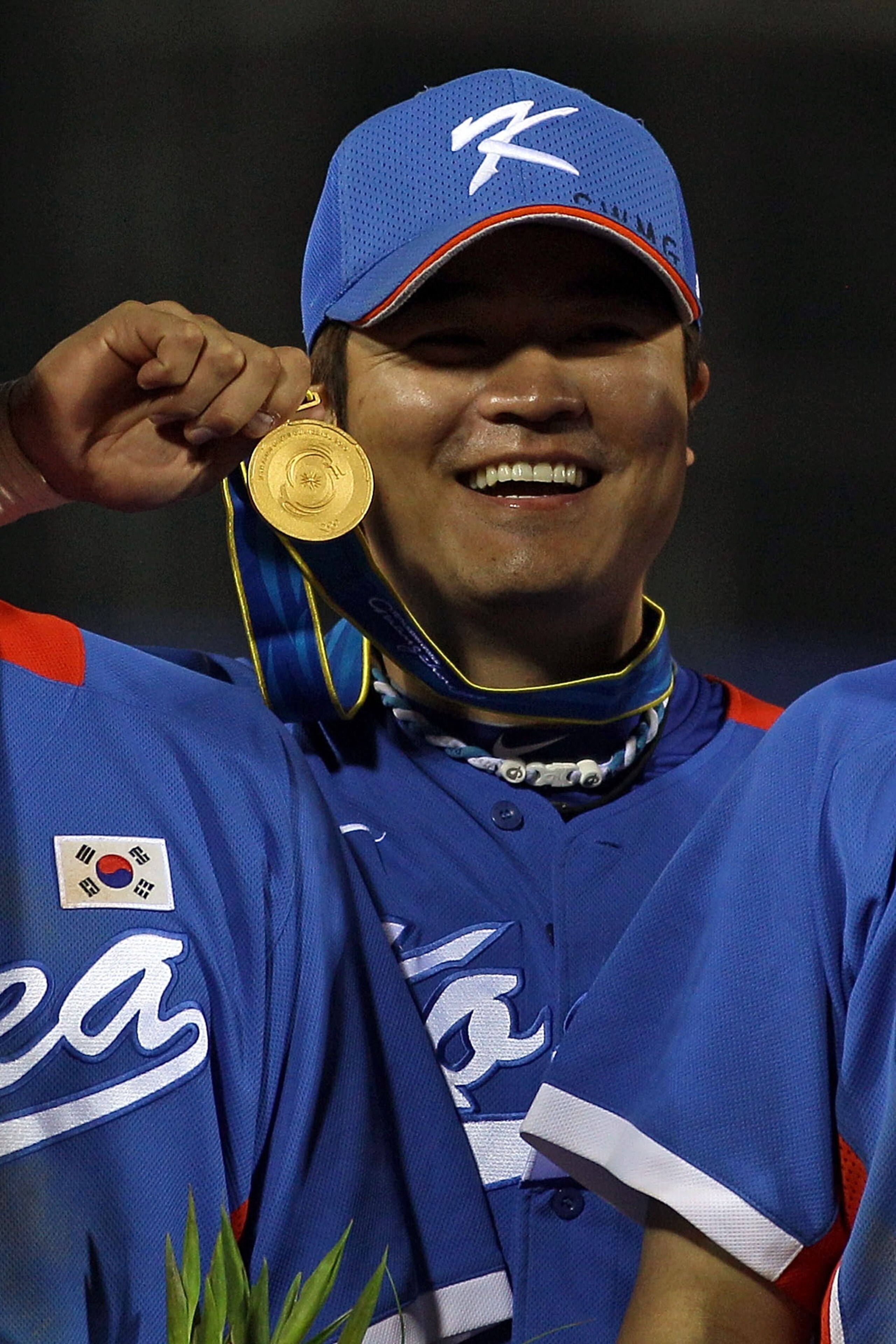 GUANGZHOU, CHINA - NOVEMBER 19: Shin-soo Choo #17 of South Korea celebrates with his gold medals after South Korea defeated Chinese Taipei 9-3 to win the gold medal at Aoti Baseball Field 1 during day seven of the 16th Asian Games Guangzhou 2010 on Novem GUANGZHOU, CHINA - NOVEMBER 19: Shin-soo Choo #17 of South Korea celebrates with his gold medals after South Korea defeated Chinese Taipei 9-3 to win the gold medal at Aoti Baseball Field 1 during day seven of the 16th Asian Games Guangzhou 2010 on Novem