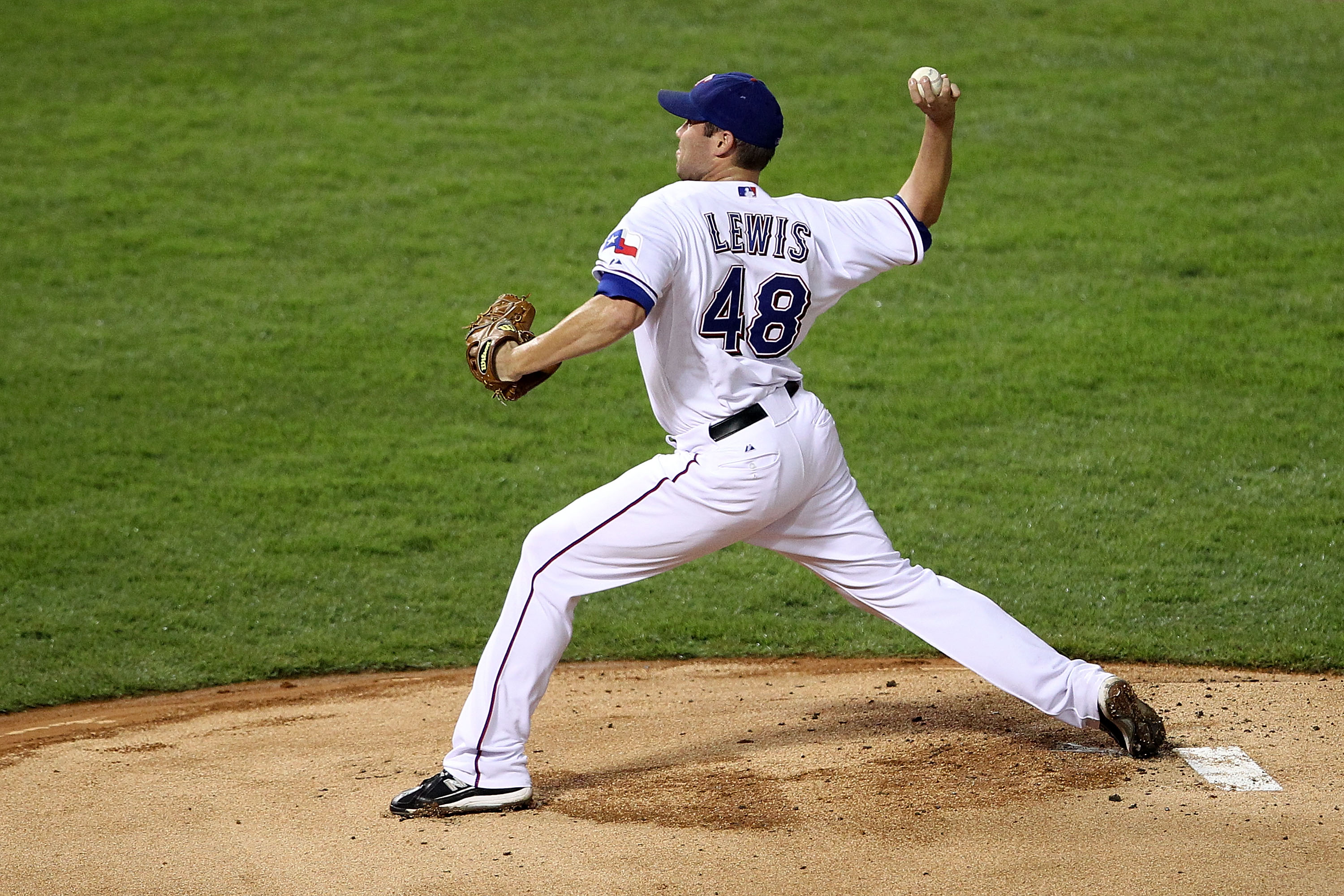 ARLINGTON, TX - OCTOBER 22:  Starting pitcher Colby Lewis #48 of the Texas Rangers pitches against the New York Yankees in the first inning of Game Six of the ALCS during the 2010 MLB Playoffs at Rangers Ballpark in Arlington on October 22, 2010 in Arling