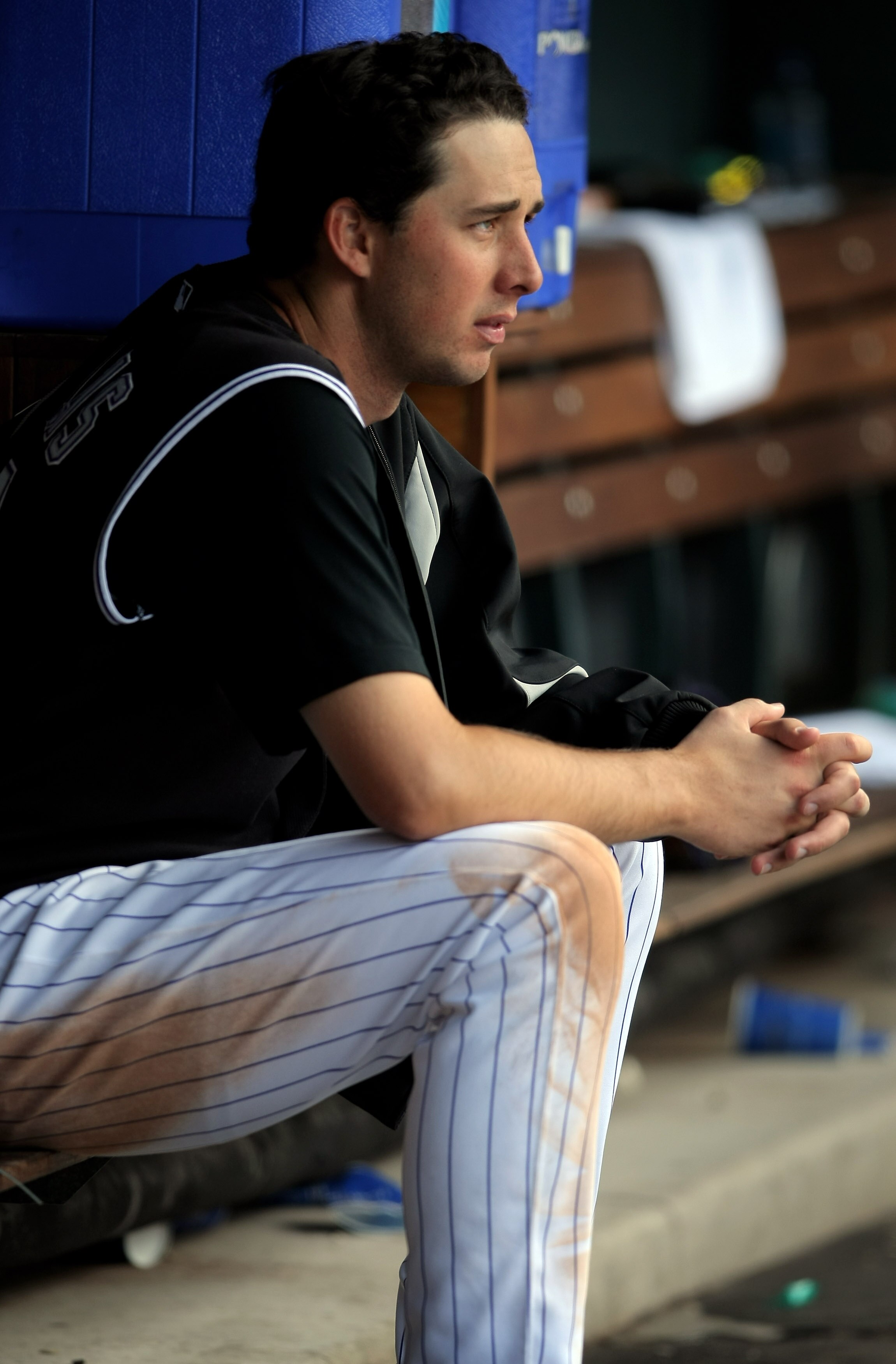 DENVER - MAY 24:  Starting pitcher Jeff Francis #26 of the Colorado Rockies as a seat in the dugout between innings as he collected the loss against the New York Mets at Coors Field on May 24, 2008 in Denver, Colorado. The Mets defeated the Rockies 9-2.