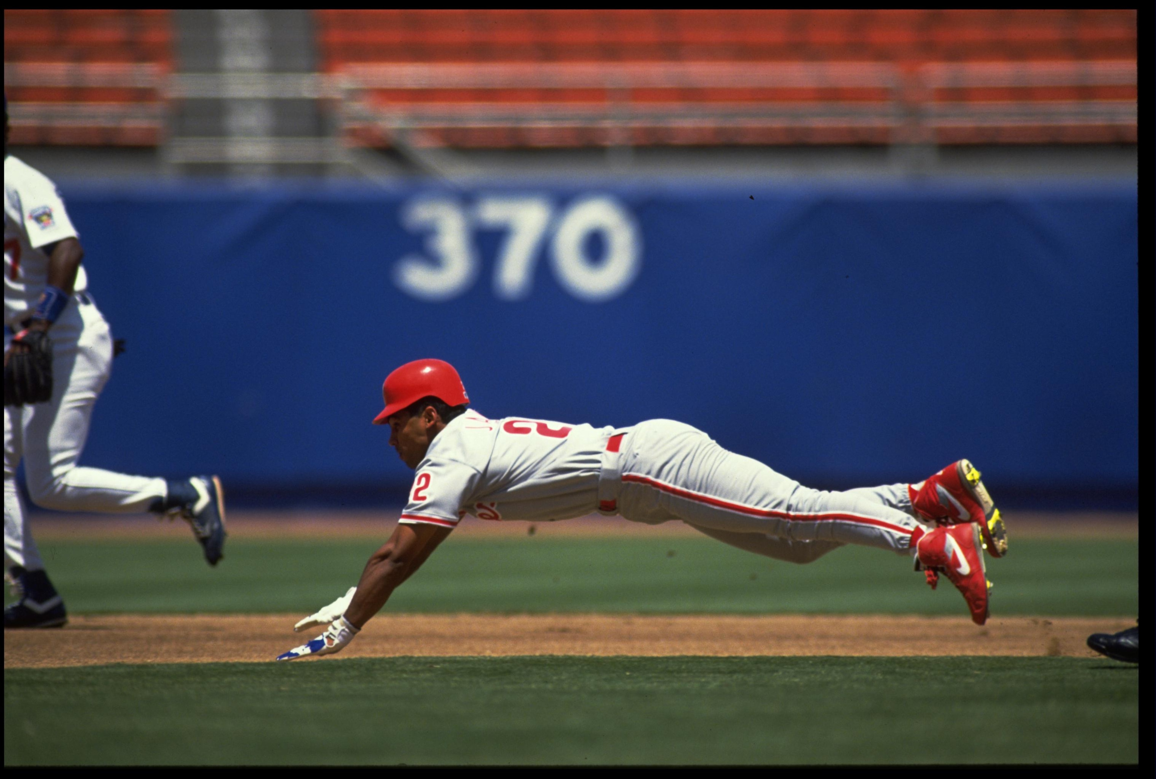 5 JUL 1992: STAN JAVIER OF THE PHILADELPHIA PHILLIES SLIDES HEAD-FIRST DURING THEIR GAME AGAINST THE LOS ANGELES DODGERS AT DODGER STADIUM IN LOS ANGELES, CALIFORNIA. MANDATORY CREDIT: STEPHEN DUNN/ALLSPORT 5 JUL 1992: STAN JAVIER OF THE PHILADELPHIA PHILLIES SLIDES HEAD-FIRST DURING THEIR GAME AGAINST THE LOS ANGELES DODGERS AT DODGER STADIUM IN LOS ANGELES, CALIFORNIA. MANDATORY CREDIT: STEPHEN DUNN/ALLSPORT