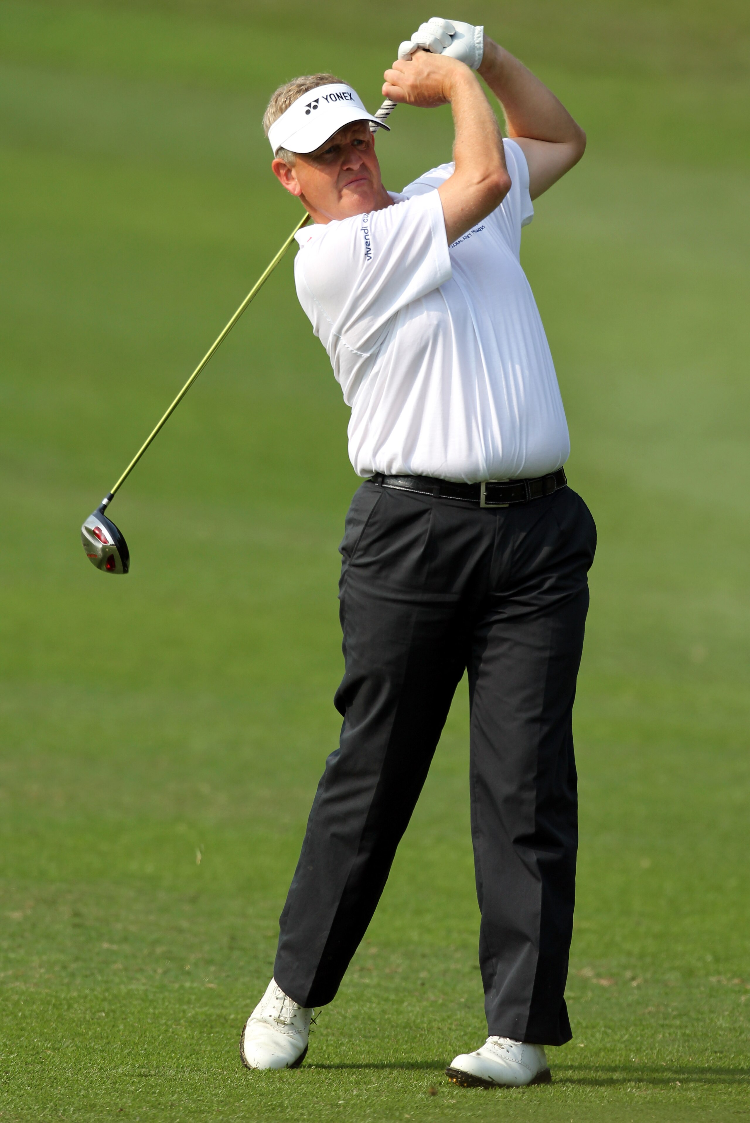 HONG KONG - NOVEMBER 19: Colin Montgomerie of Scotland plays his 2nd shot on the 3rd hole during day two of the UBS Hong Kong Open at The Hong Kong Golf Club on November 19, 2010 in Hong Kong, Hong Kong. ( Photo By : Stanley Chou/Getty Images )