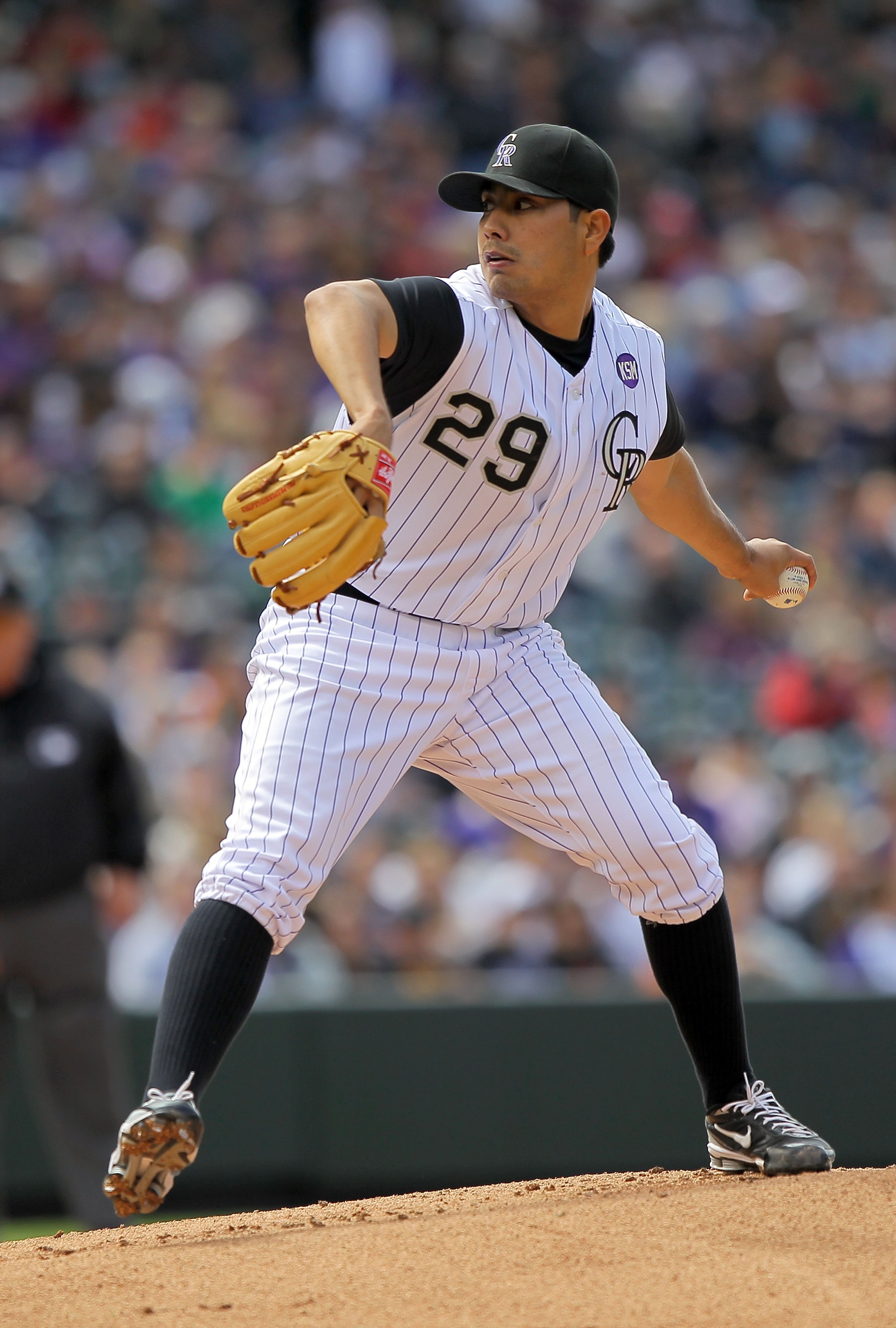 DENVER - APRIL 25:  Starting pitcher Jorge De La Rosa #29 of the Colorado Rockies delivers against the Florida Marlins at Coors Field on April 25, 2010 in Denver, Colorado. De La Rosa earned the win as the Rockies defeated the Marlins 8-4.  (Photo by Doug