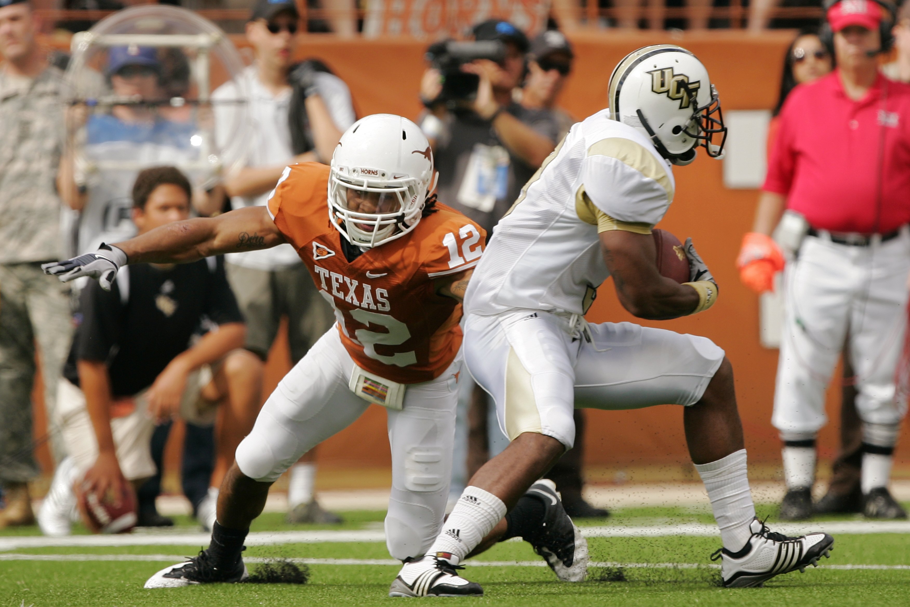 AUSTIN, TX - NOVEMBER 07:  Safety Earl Thomas #12 of the Texas Longhorns makes a tackle against the UCF Knights on November 7, 2009 at Darrell K Royal - Texas Memorial Stadium in Austin, Texas.  Texas won 35-3.  (Photo by Brian Bahr/Getty Images)
