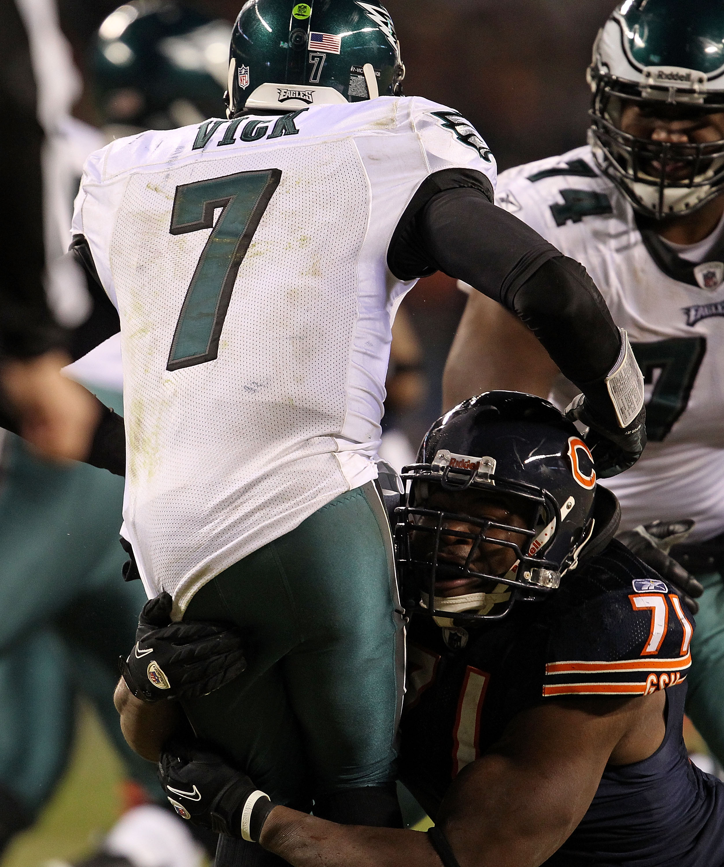 CHICAGO - NOVEMBER 28: Israel Idonije #71 of the Chicago Bears hits Michael Vick #7 of the Philadelphia Eagles at Soldier Field on November 28, 2010 in Chicago, Illinois. The Bears defeated the Eagles 31-26. (Photo by Jonathan Daniel/Getty Images)