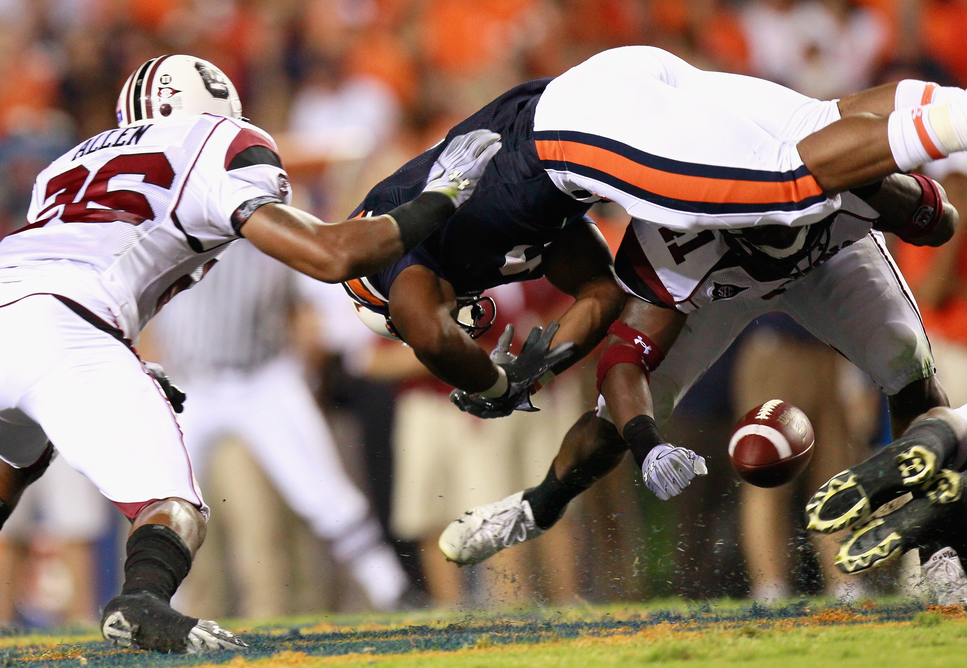 AUBURN, AL - SEPTEMBER 25:  Antonio Allen #26 and Josh Dickerson #41 of the South Carolina Gamecocks force a fumble by Michael Dyer #5 of the Auburn Tigers at Jordan-Hare Stadium on September 25, 2010 in Auburn, Alabama.  (Photo by Kevin C. Cox/Getty Imag