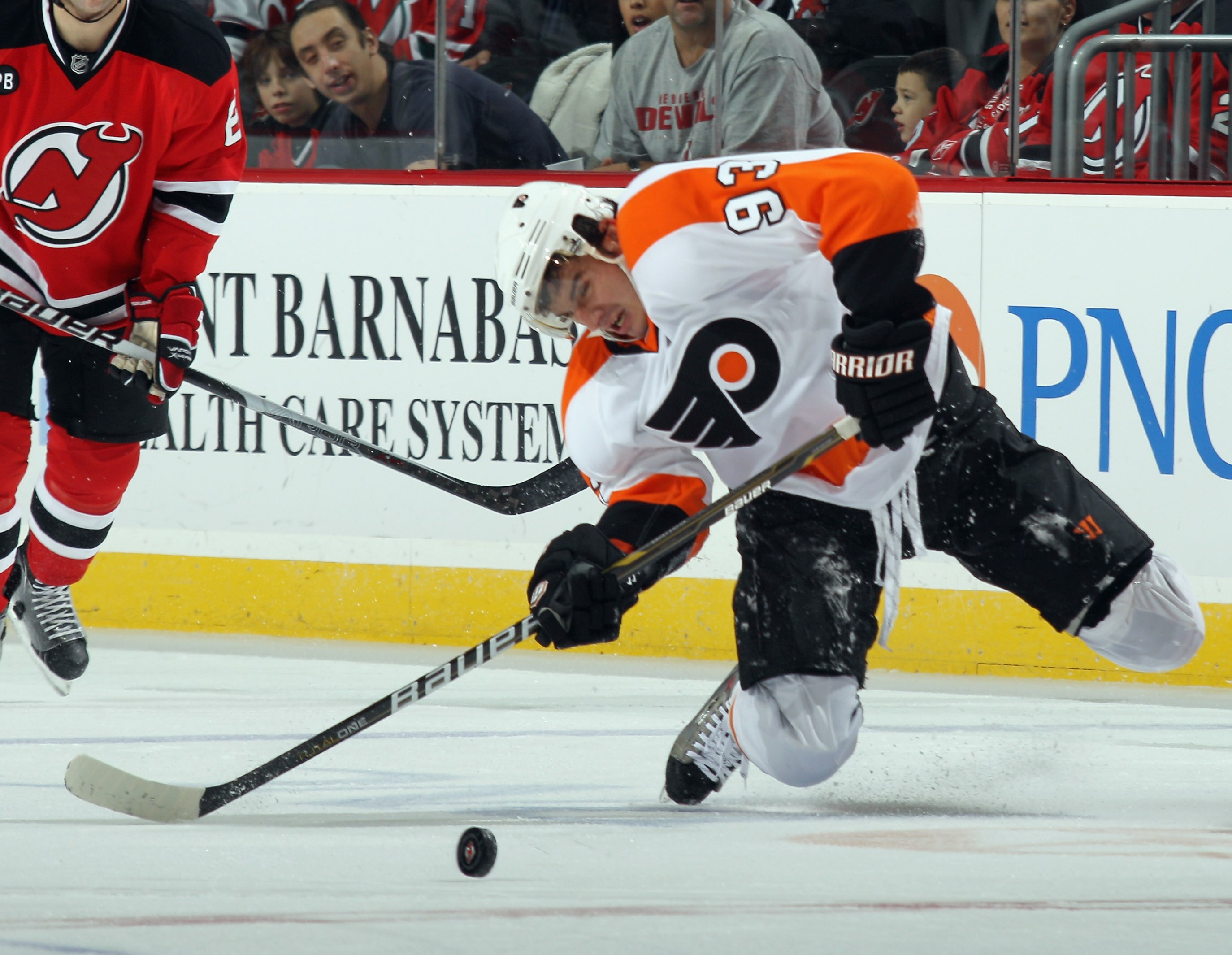 NEWARK, NJ - NOVEMBER 27: Nikolay Zherdev #93 of the Philadelphia Flyers struggles to maintain control of the puck in his game against the New Jersey Devils at the Prudential Center on November 27, 2010 in Newark, New Jersey.  (Photo by Bruce Bennett/Gett
