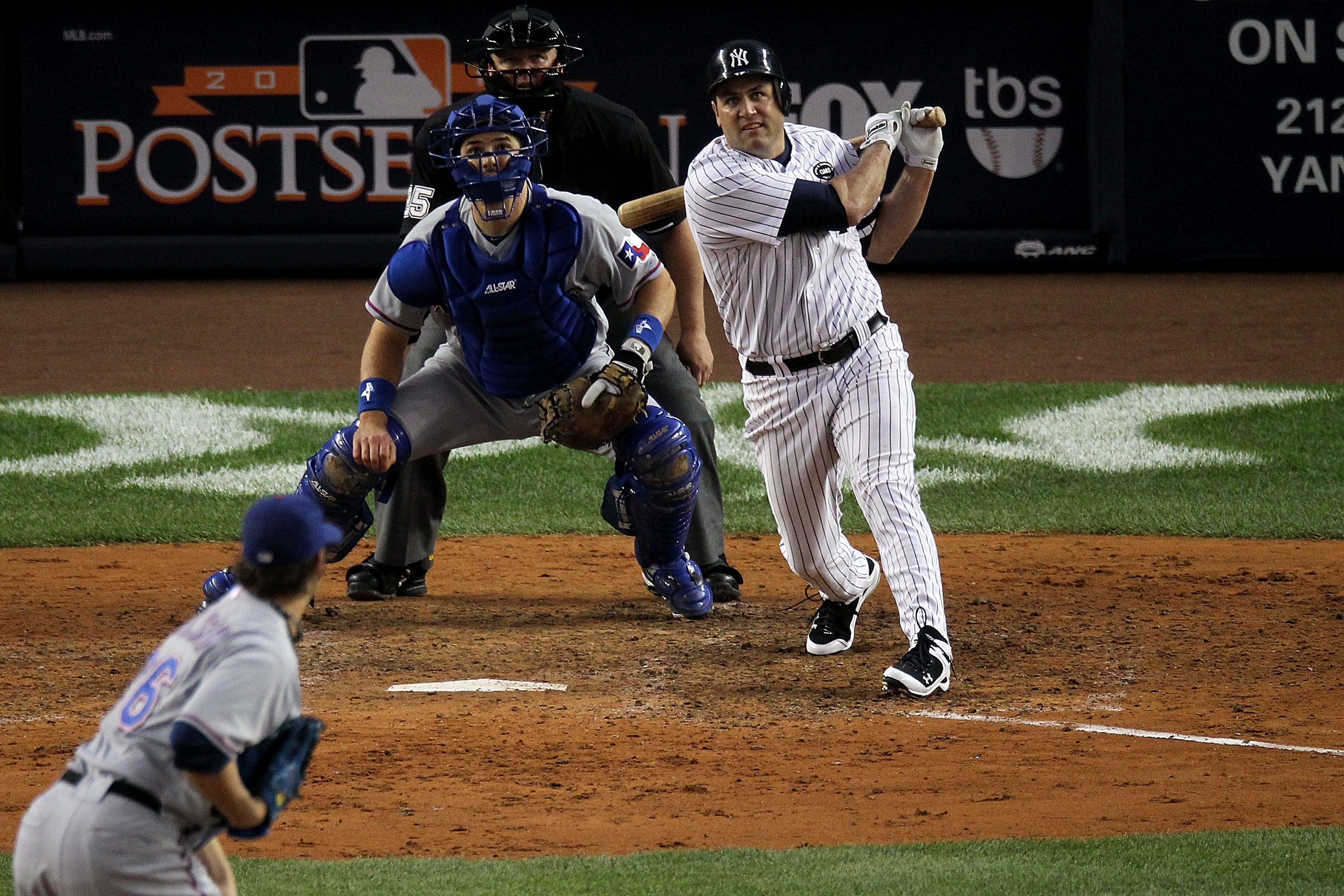 NEW YORK - OCTOBER 20:  Lance Berkman #17 of the New York Yankees hits a RBI sacrafice fly in the bottom of the fifth inning against the Texas Rangers in Game Five of the ALCS during the 2010 MLB Playoffs at Yankee Stadium on October 20, 2010 in the Bronx