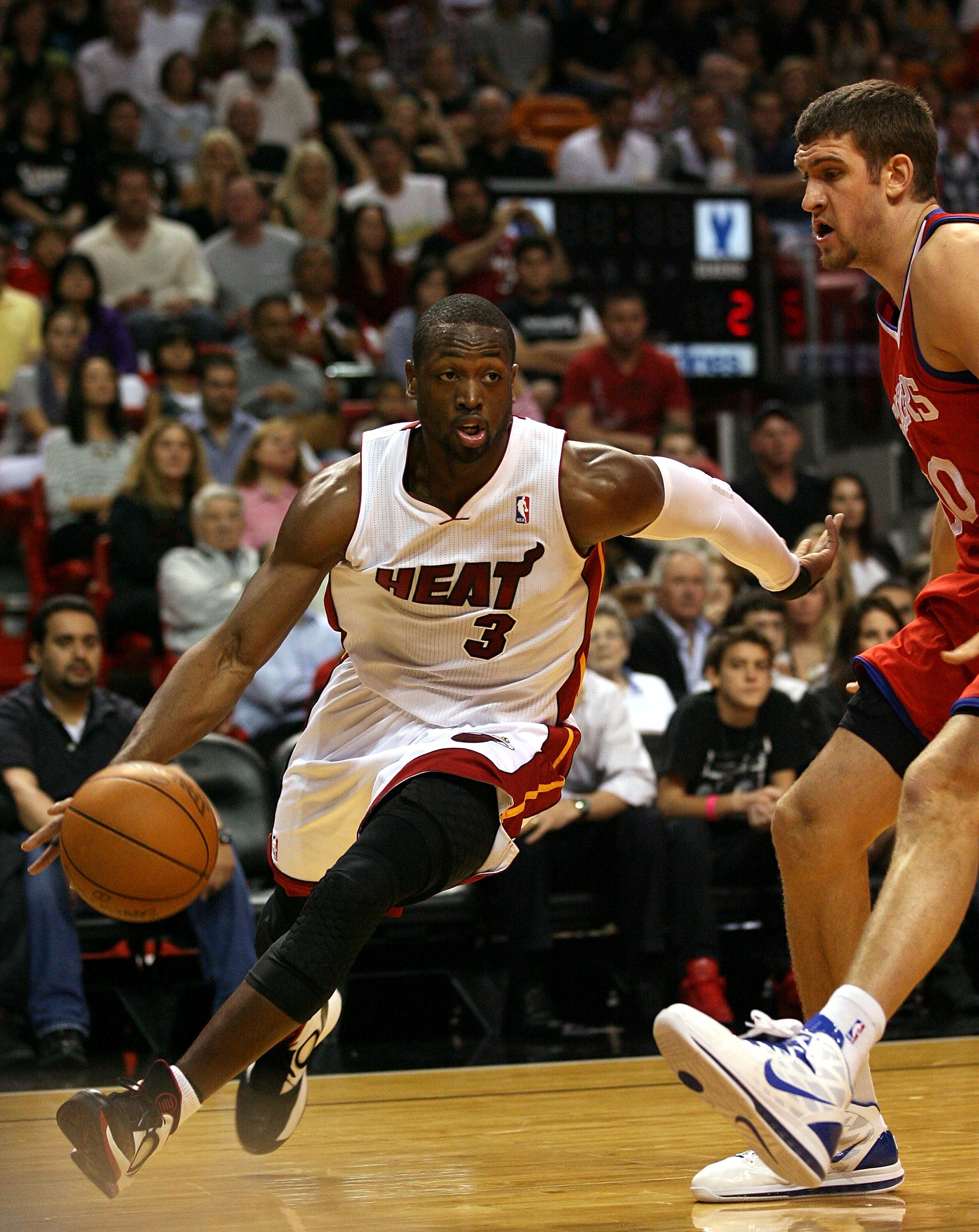 MIAMI - NOVEMBER 26:  Guard Dwyane Wade #3 of the Miami Heat drives against the Philadelphia 76ers at American Airlines Arena on November 26, 2010 in Miami, Florida. The Heat defeated the 76ers 99-90.  (Photo by Marc Serota/Getty Images)