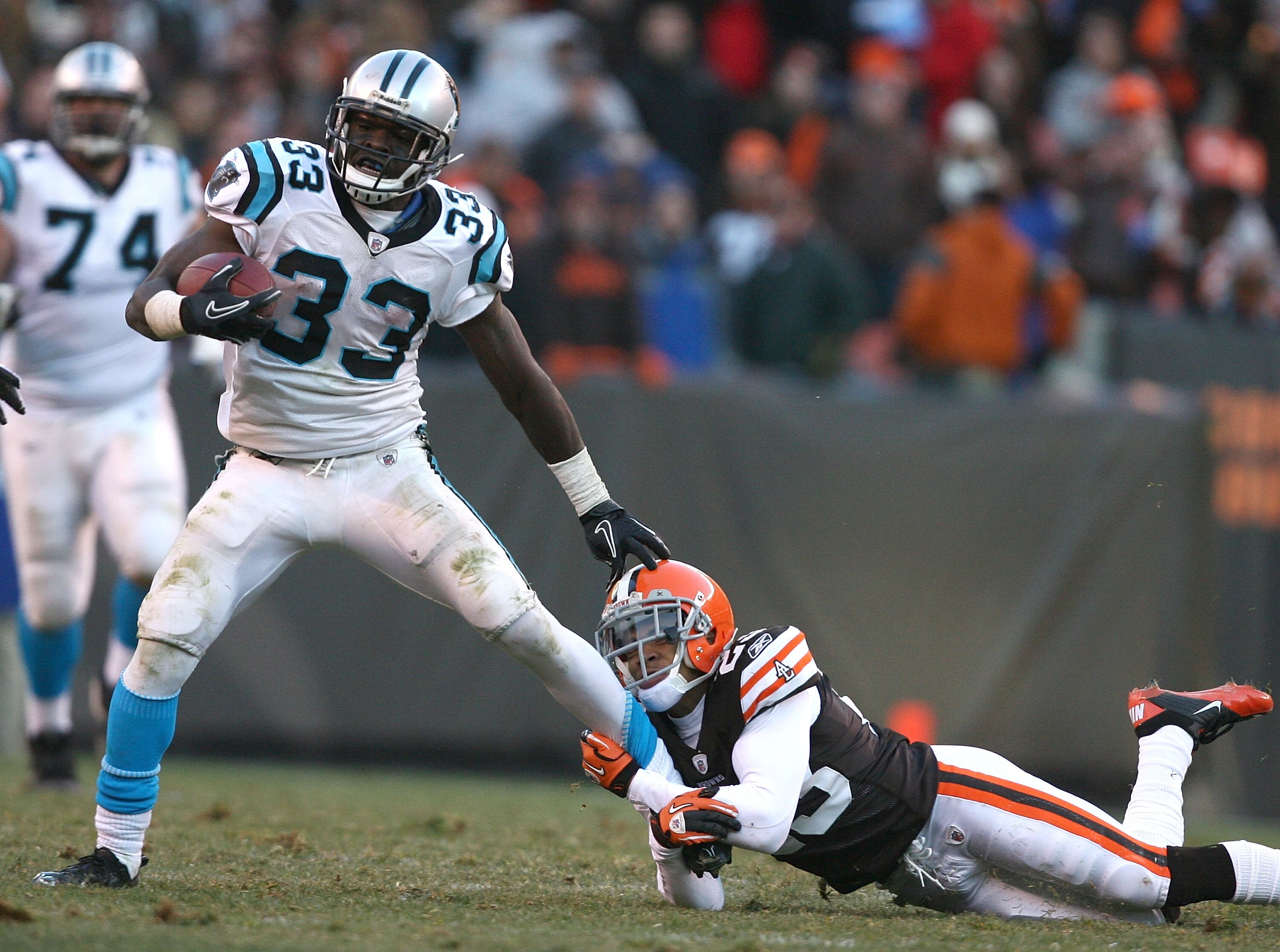 CLEVELAND - NOVEMBER 28:  running back Mike Goodson #33 of the Carolina Panthers is hit by defensive back Joe Haden #23 of the Cleveland Browns at Cleveland Browns Stadium on November 28, 2010 in Cleveland, Ohio.  (Photo by Matt Sullivan/Getty Images)