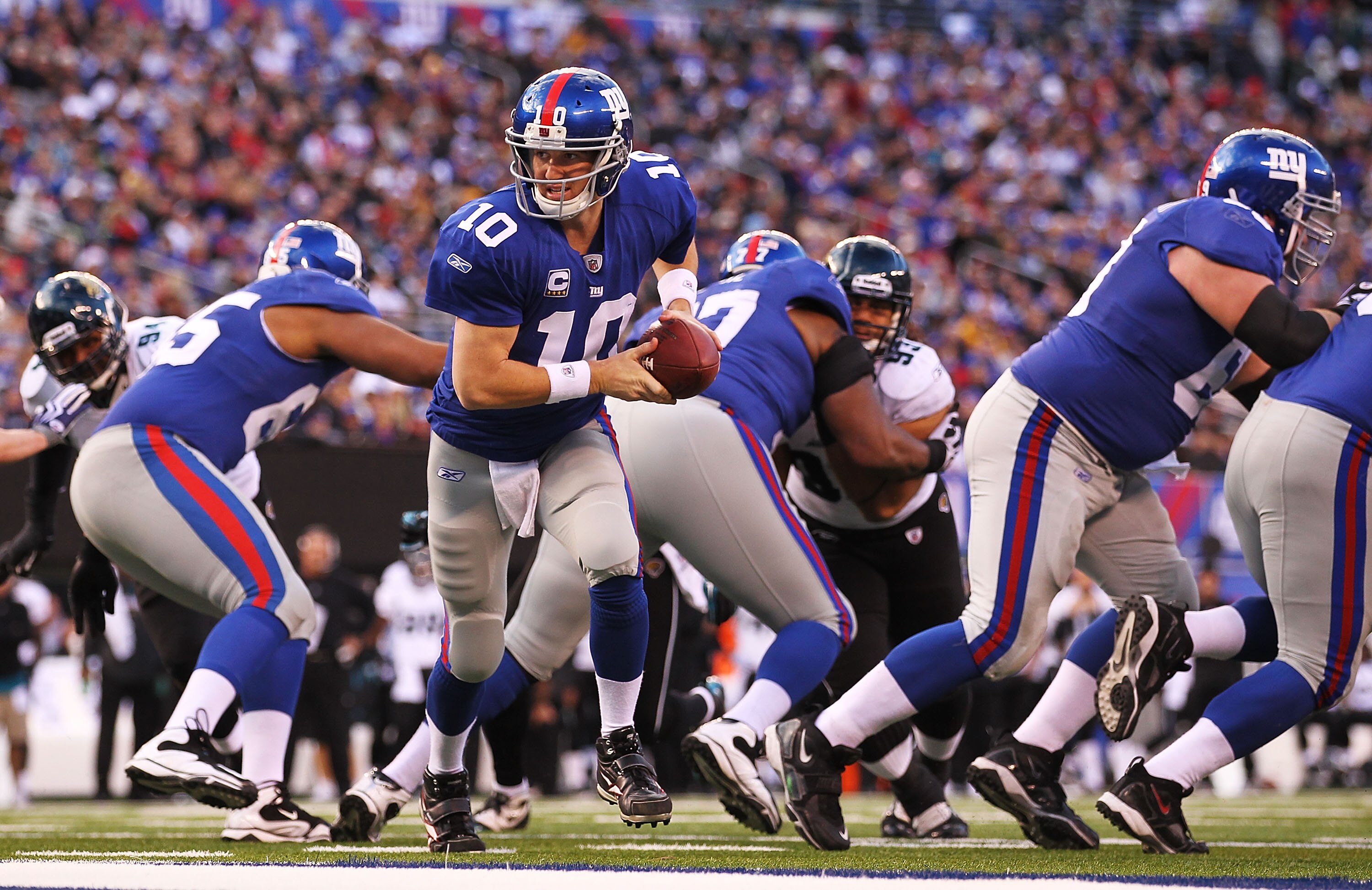 EAST RUTHERFORD, NJ - NOVEMBER 28:  Eli Manning #10 of the New York Giants looks to hand the ball off during the game against  the Jacksonville Jaguars on November 28, 2010 at The New Meadowlands Stadium in East Rutherford, New Jersey.  (Photo by Al Bello