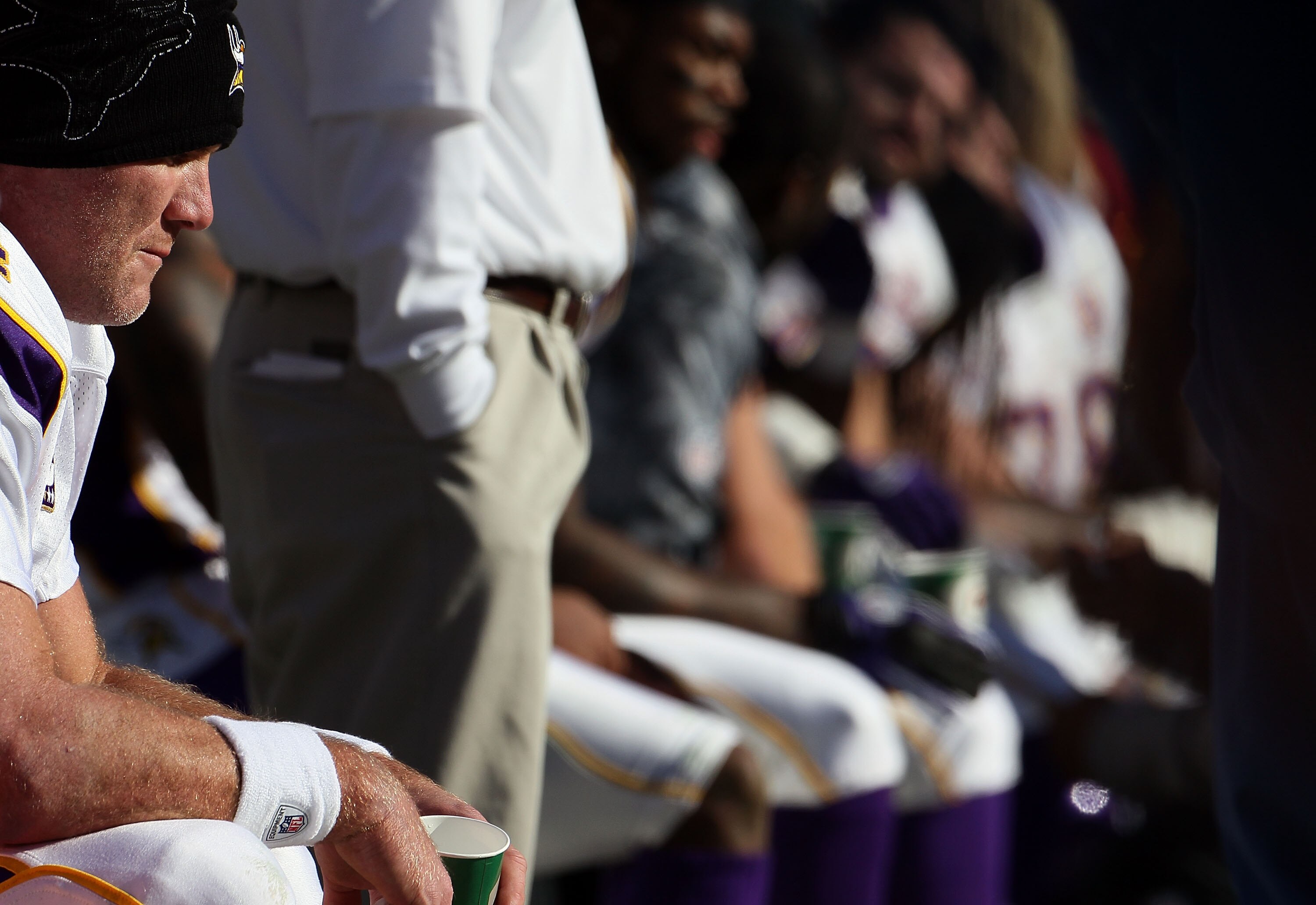 LANDOVER, MD - NOVEMBER 28:  Brett Favre #4 of the Minnesota Vikings sits ont the bench between offensive series against the Washington Redskins at FedExField November 28, 2010 in Landover, Maryland. The Vikings won the game 17-13.  (Photo by Win McNamee/