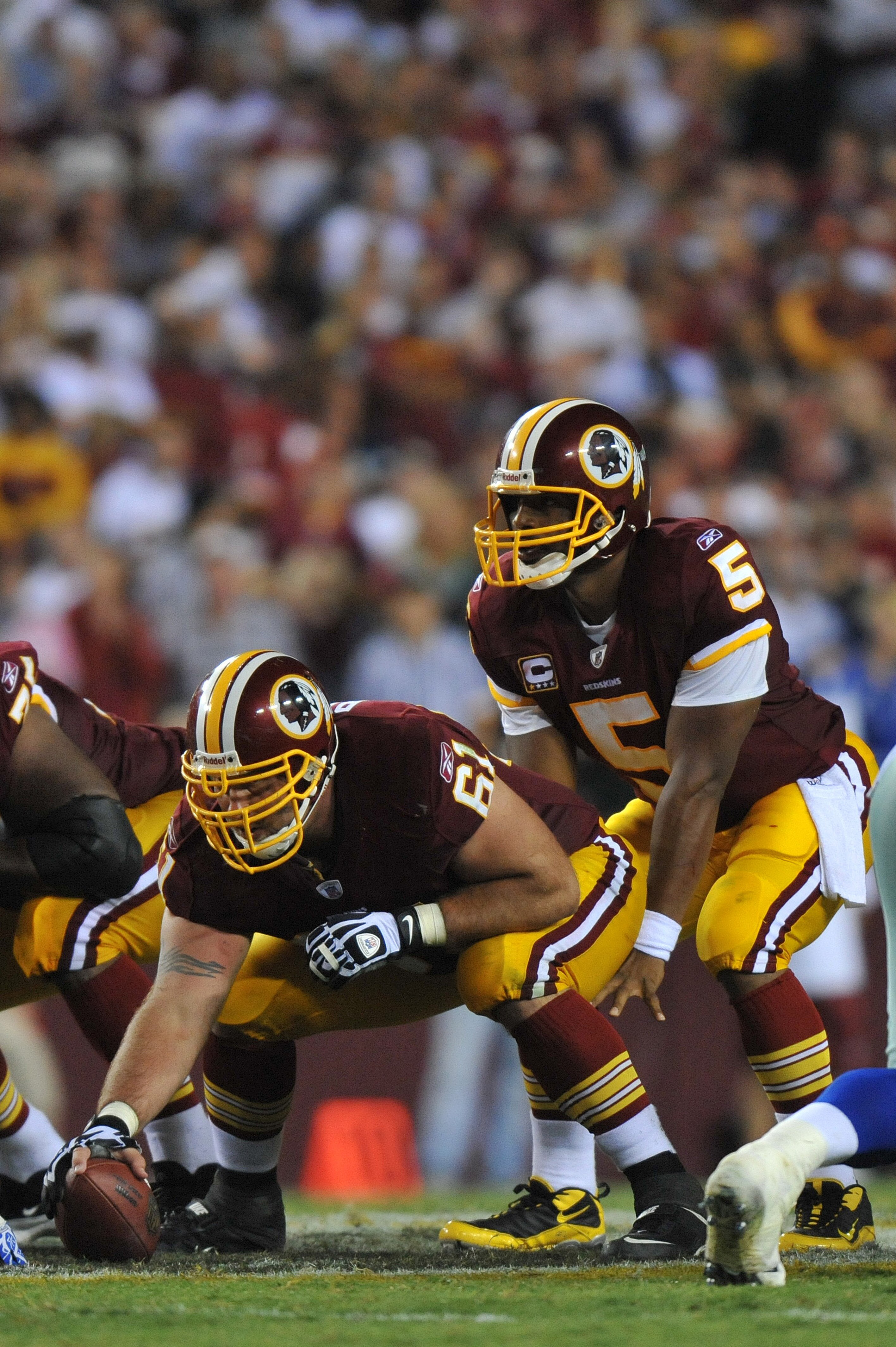 LANDOVER - SEPTEMBER 12:  Casey Rabach #61 of the Washington Redskins prepares to snap the ball during the NFL season opener against the Dallas Cowboys at FedExField on September 12, 2010 in Landover, Maryland. The Redskins defeated the Cowboys 13-7. (Pho