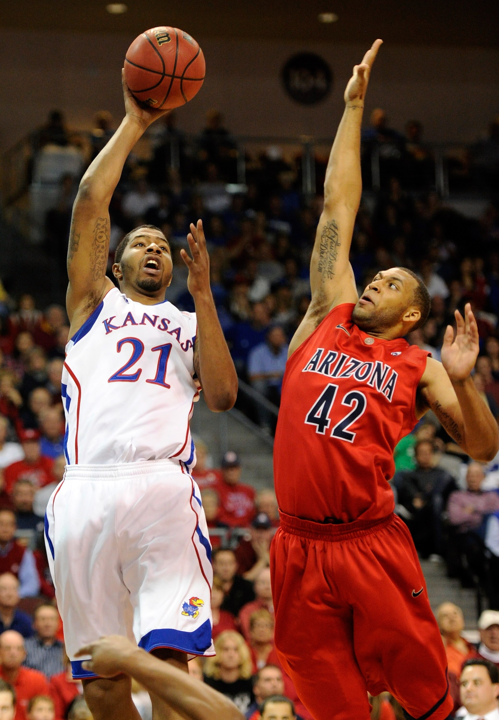 LAS VEGAS - NOVEMBER 27:  Markieff Morris #21 of the Kansas Jayhawks shoots against Solomon Hill #42 of the Arizona Wildcats during the championship game of the Las Vegas Invitational at The Orleans Arena November 27, 2010 in Las Vegas, Nevada.  (Photo by