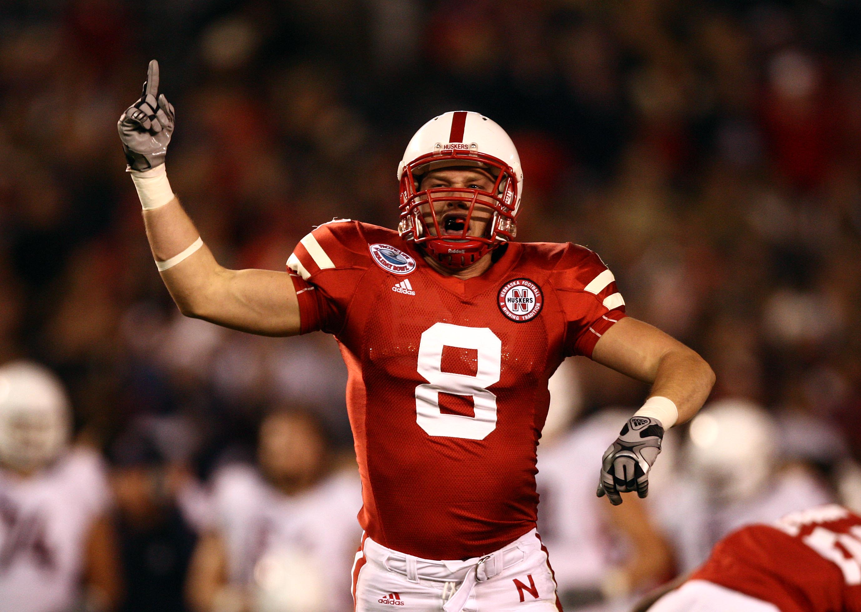 SAN DIEGO, CA - DECEMBER 30:  Safety Austin Cassidy #8 of the University of Nebraska Cornhuskers celebrates a tackle against the University of Arizona Wildcats during the Pacific Life Holiday Bowl,  on December 30, 2009 at Qualcomm Stadium in San Diego, C