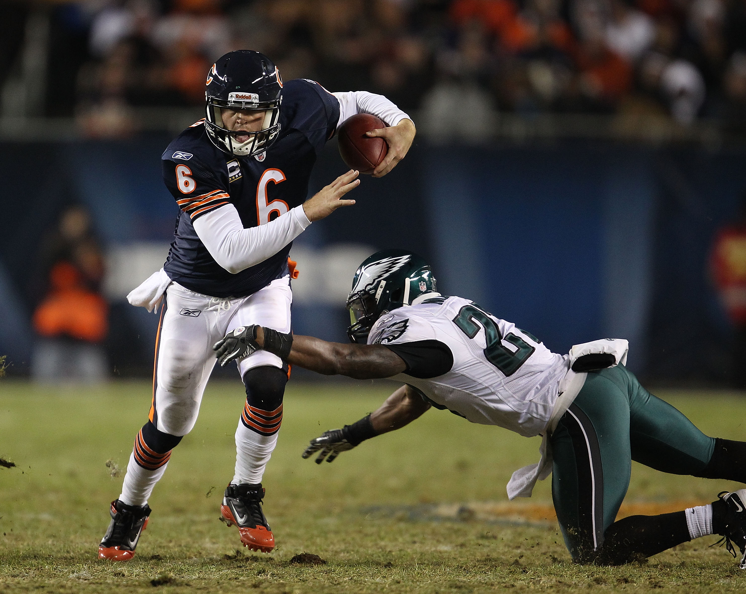 CHICAGO - NOVEMBER 28: Jay Cutler #6 of the Chicago Bears breaks away from Quintin Mikell #27 of the Philadelphia Eagles at Soldier Field on November 28, 2010 in Chicago, Illinois. The Bears defeated the Eagles 31-26. (Photo by Jonathan Daniel/Getty Image