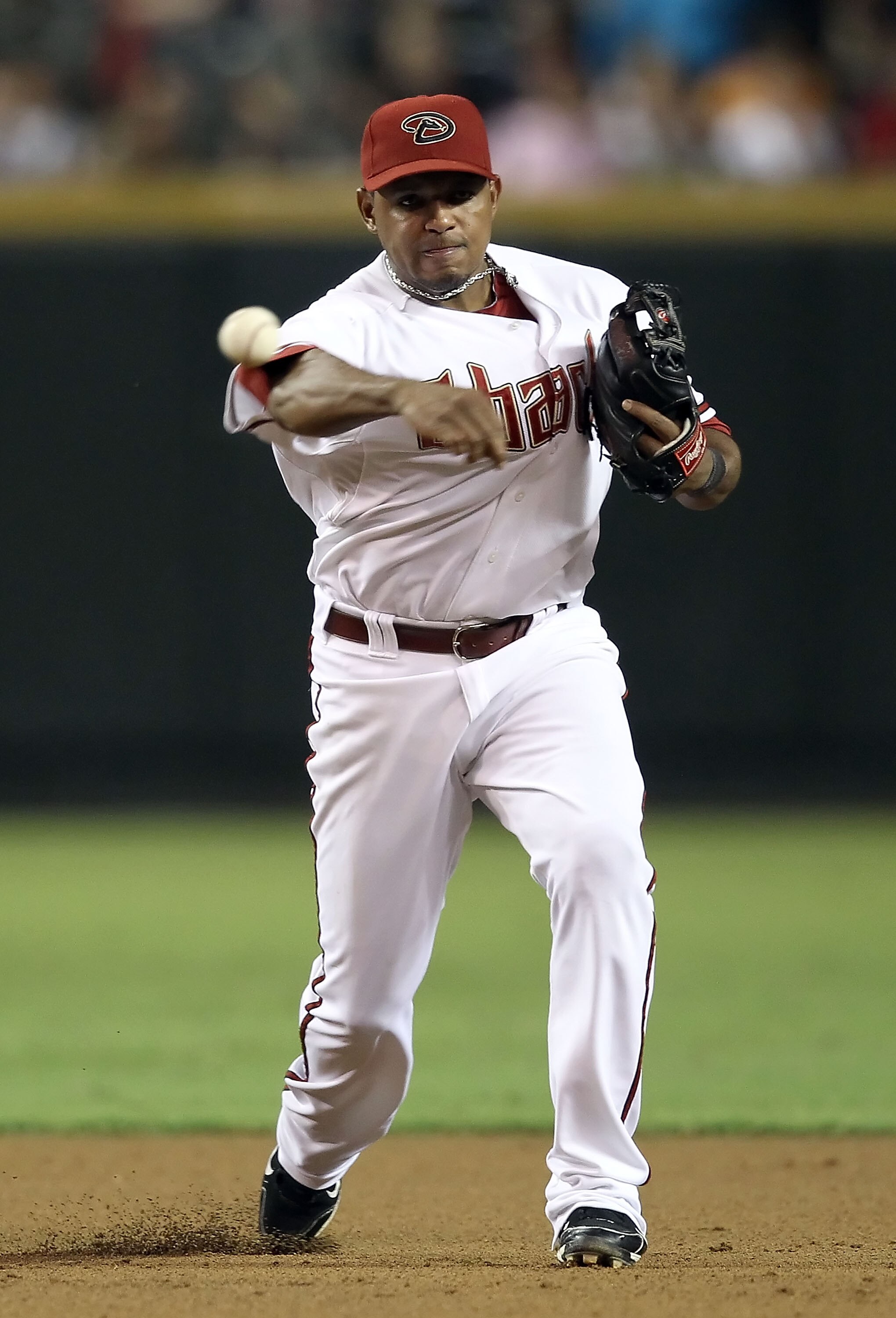 PHOENIX - SEPTEMBER 24:  Infielder Tony Abreu #3 of the Arizona Diamondbacks fields a ground ball out during the Major League Baseball game against the Los Angeles Dodgers at Chase Field on September 24, 2010 in Phoenix, Arizona.  (Photo by Christian Pete