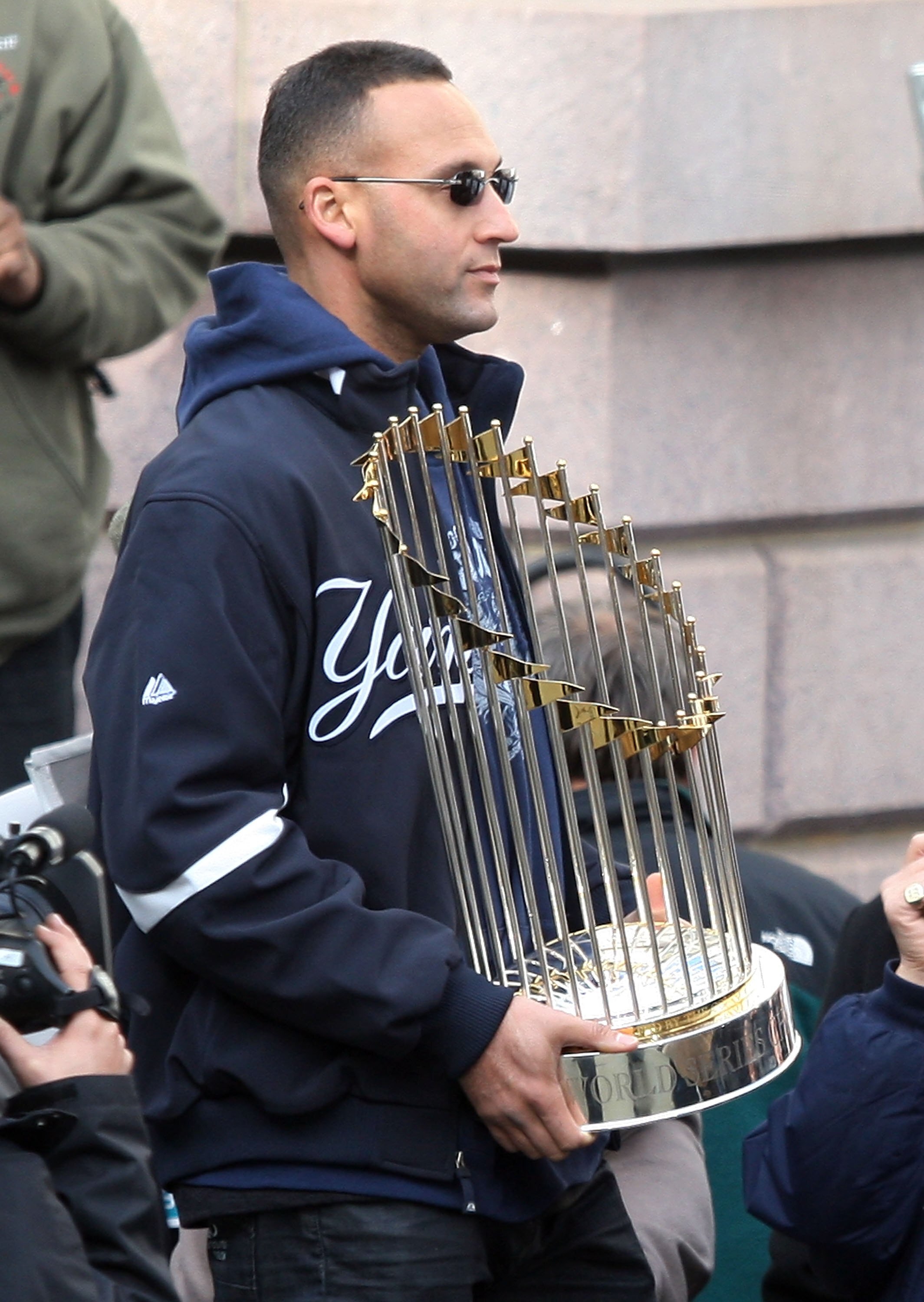 NEW YORK - NOVEMBER 06:  Captain Derek Jeter #2 of the New York Yankees celebrates with the championship trophy during the New York Yankees World Series Victory Celebration at City Hall on November 6, 2009 in New York, New York.  (Photo by Jim McIsaac/Get